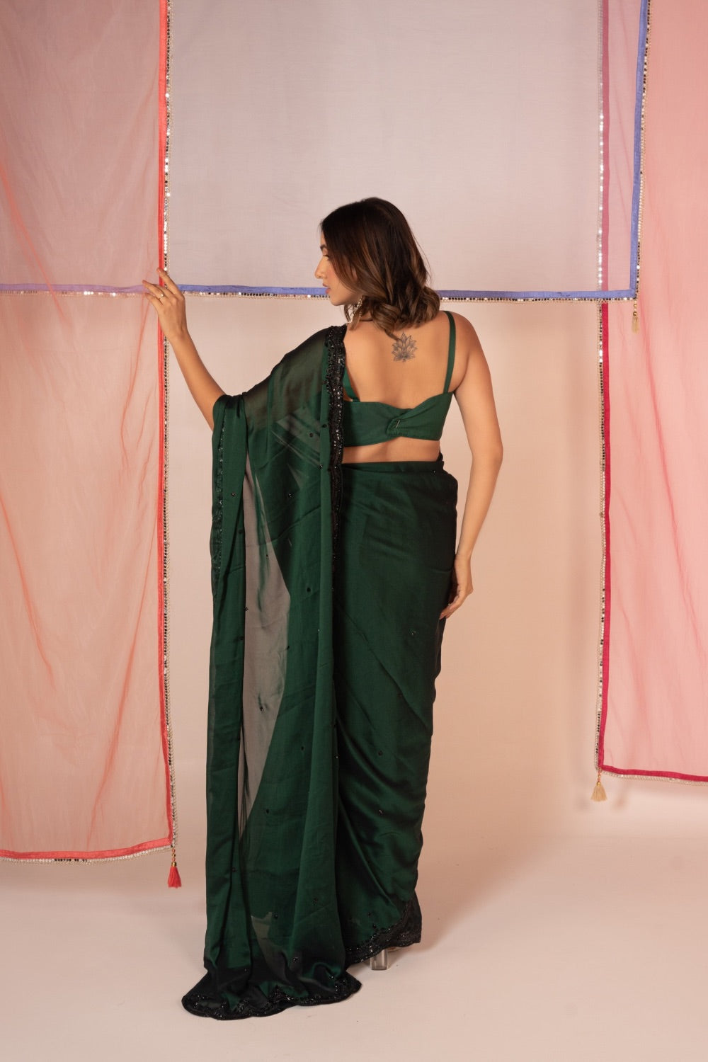 Bottle green satin silk saree and unstitched blouse piece