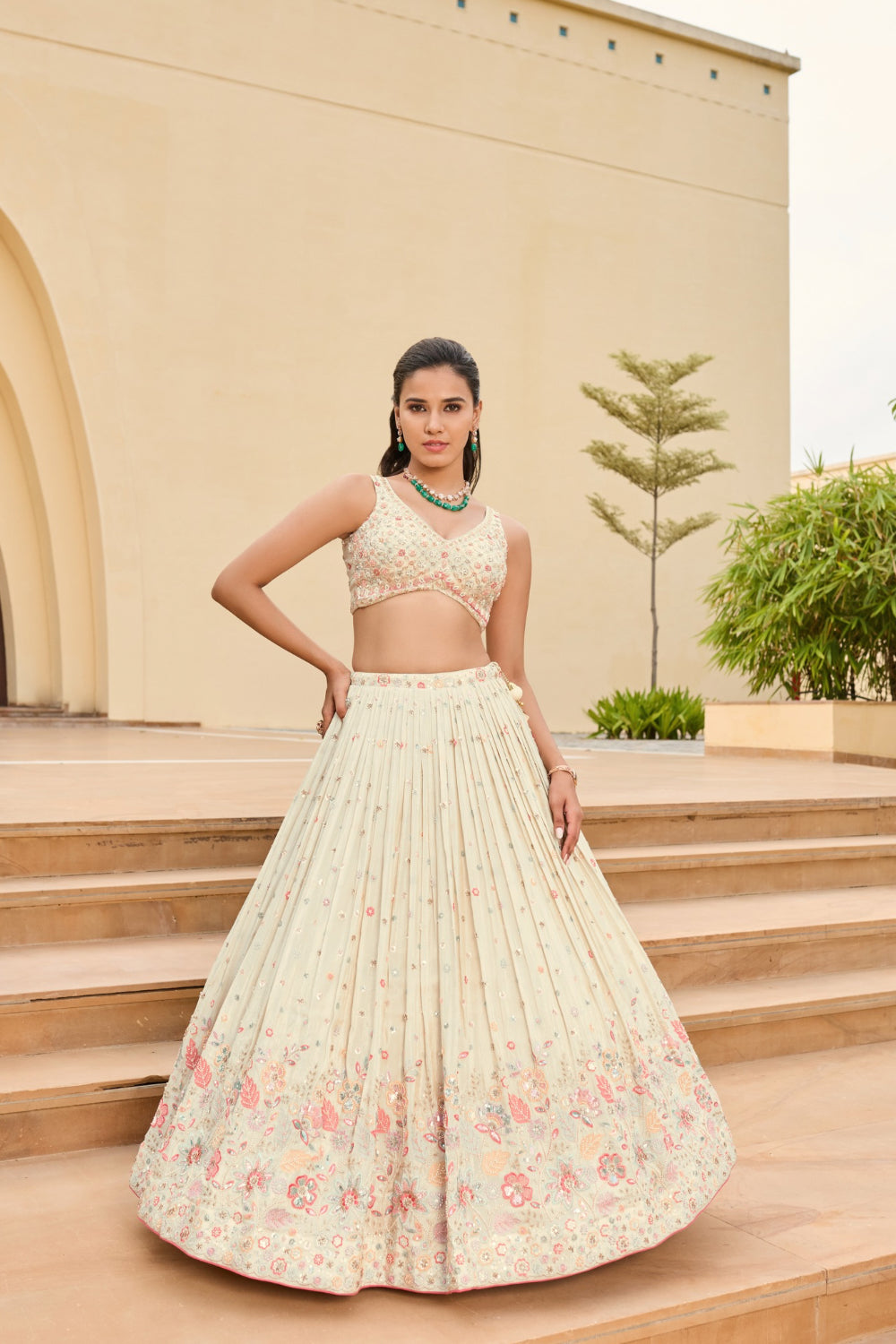 Off-white silk lehenga choli with sequins and hand cut dana work