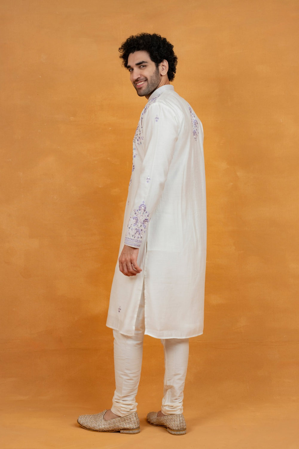 Cream silk kurta set with lavender resham embroidery and mirror work