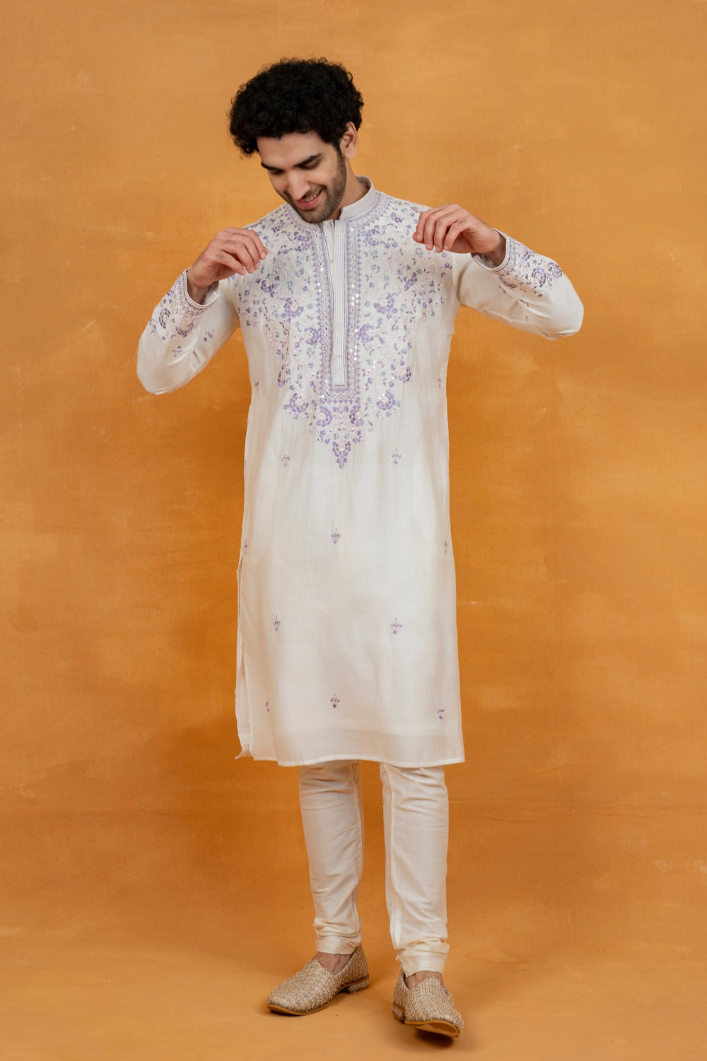 Cream silk kurta set with lavender resham embroidery and mirror work