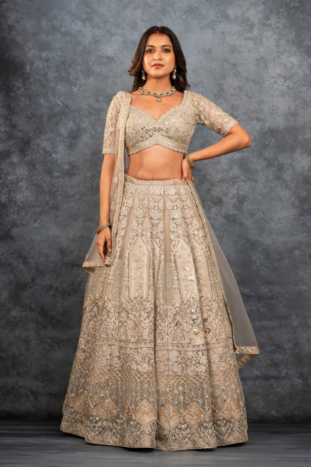 Ivory soft silk zardozi embroidered lehenga choli with hand cut dana work