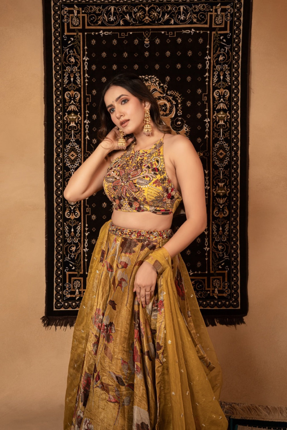 Yellow tissue silk lehenga choli with knot and cut dana work