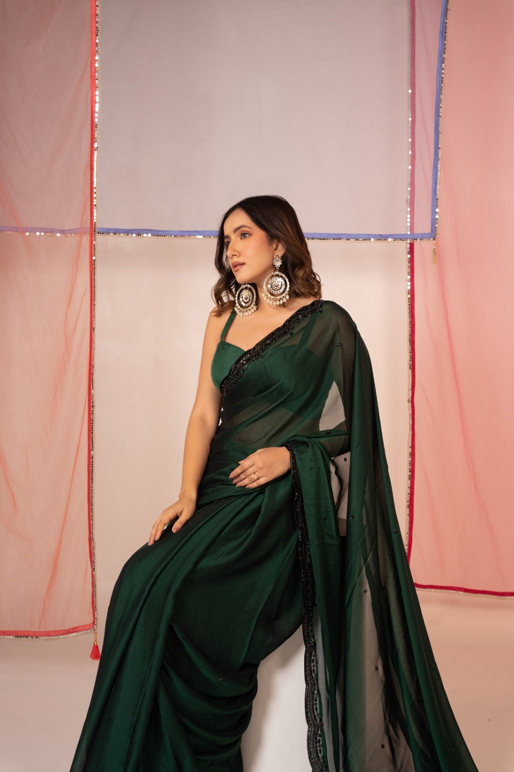 Bottle green satin silk saree and unstitched blouse piece