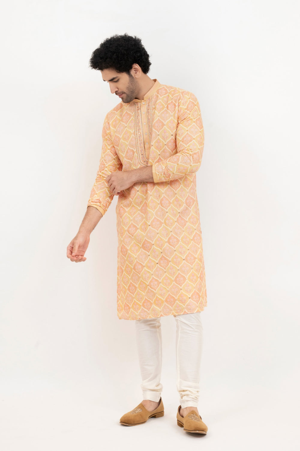 Light orange lucknowi position print kurta set with morror and thread work on yoke