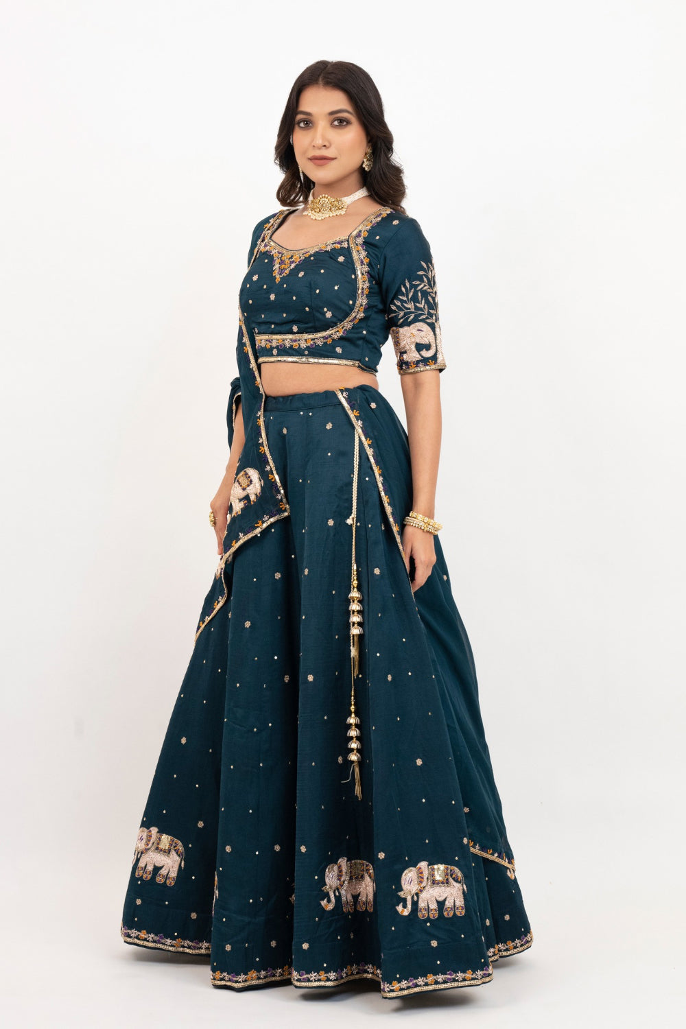 Peacock blue soft silk zardozi embroidered lehenga choli with hand cut dana work