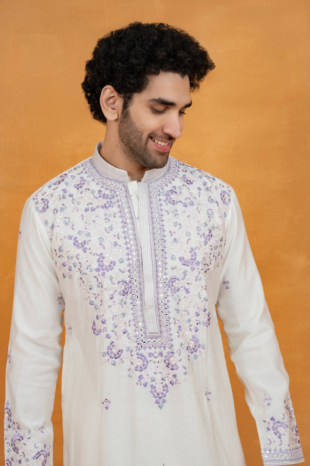 Cream silk kurta set with lavender resham embroidery and mirror work