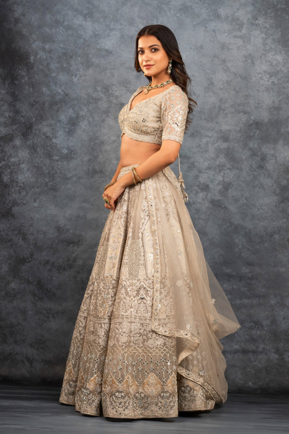 Ivory soft silk zardozi embroidered lehenga choli with hand cut dana work