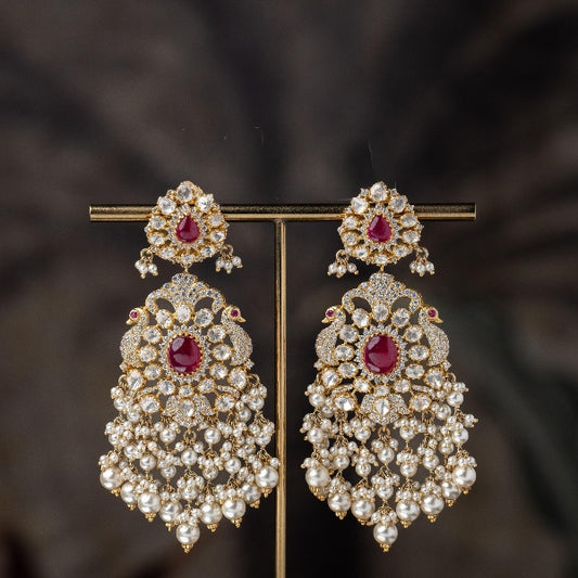 White Polki Studded with Peacock Motif Silver Earrings