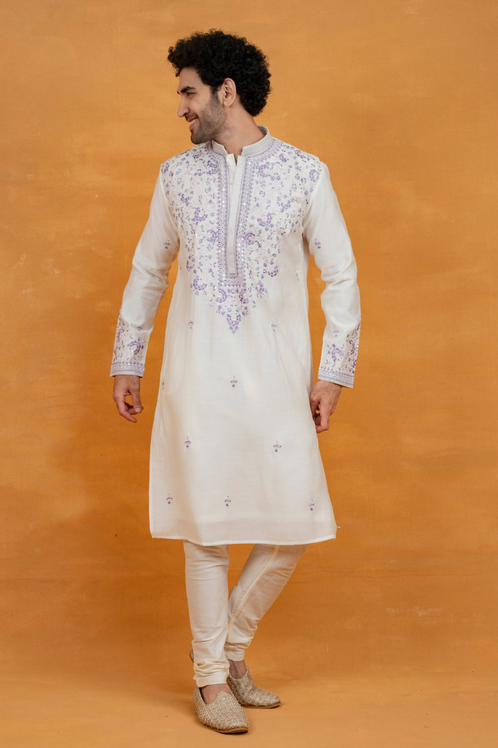 Cream silk kurta set with lavender resham embroidery and mirror work