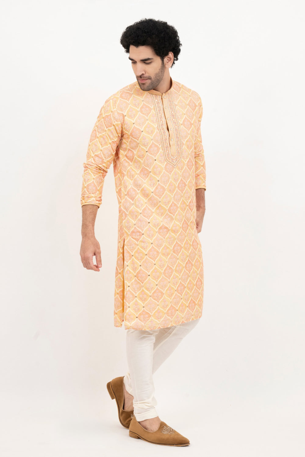 Light orange lucknowi position print kurta set with morror and thread work on yoke