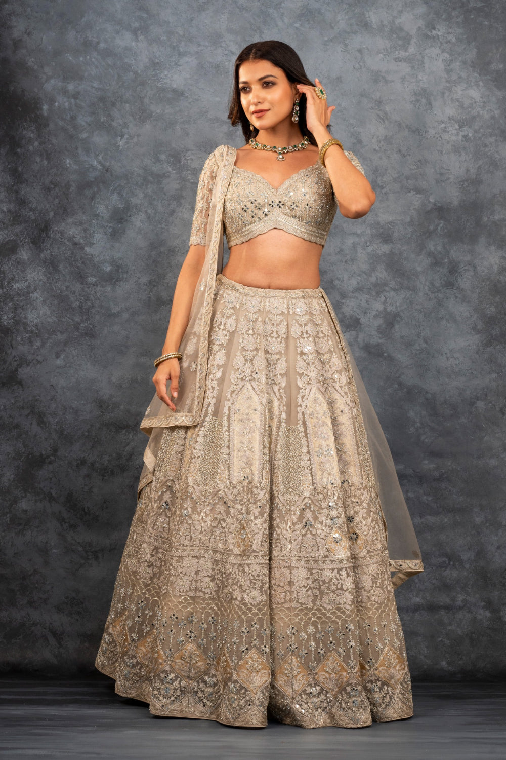 Ivory soft silk zardozi embroidered lehenga choli with hand cut dana work