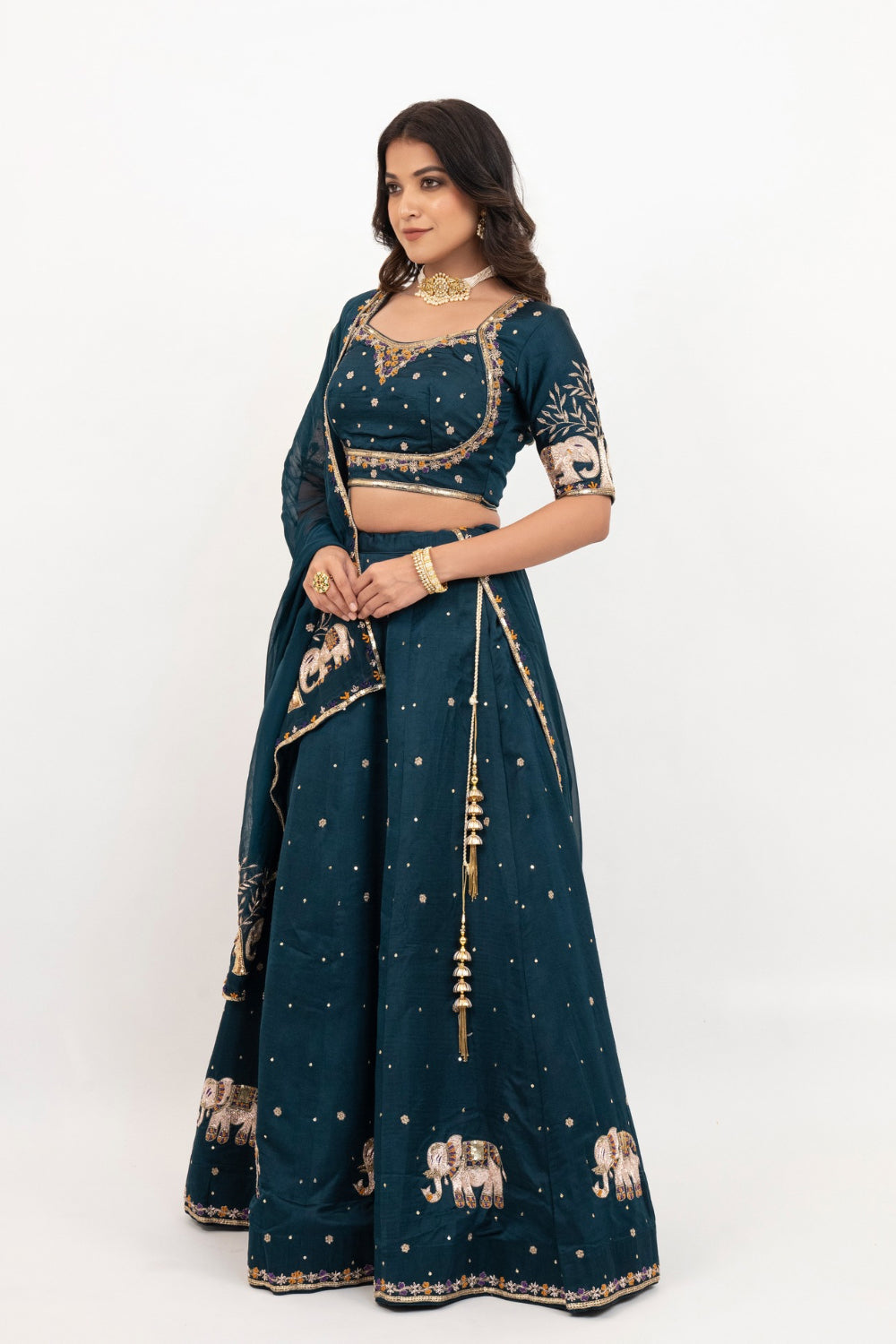Peacock blue soft silk zardozi embroidered lehenga choli with hand cut dana work