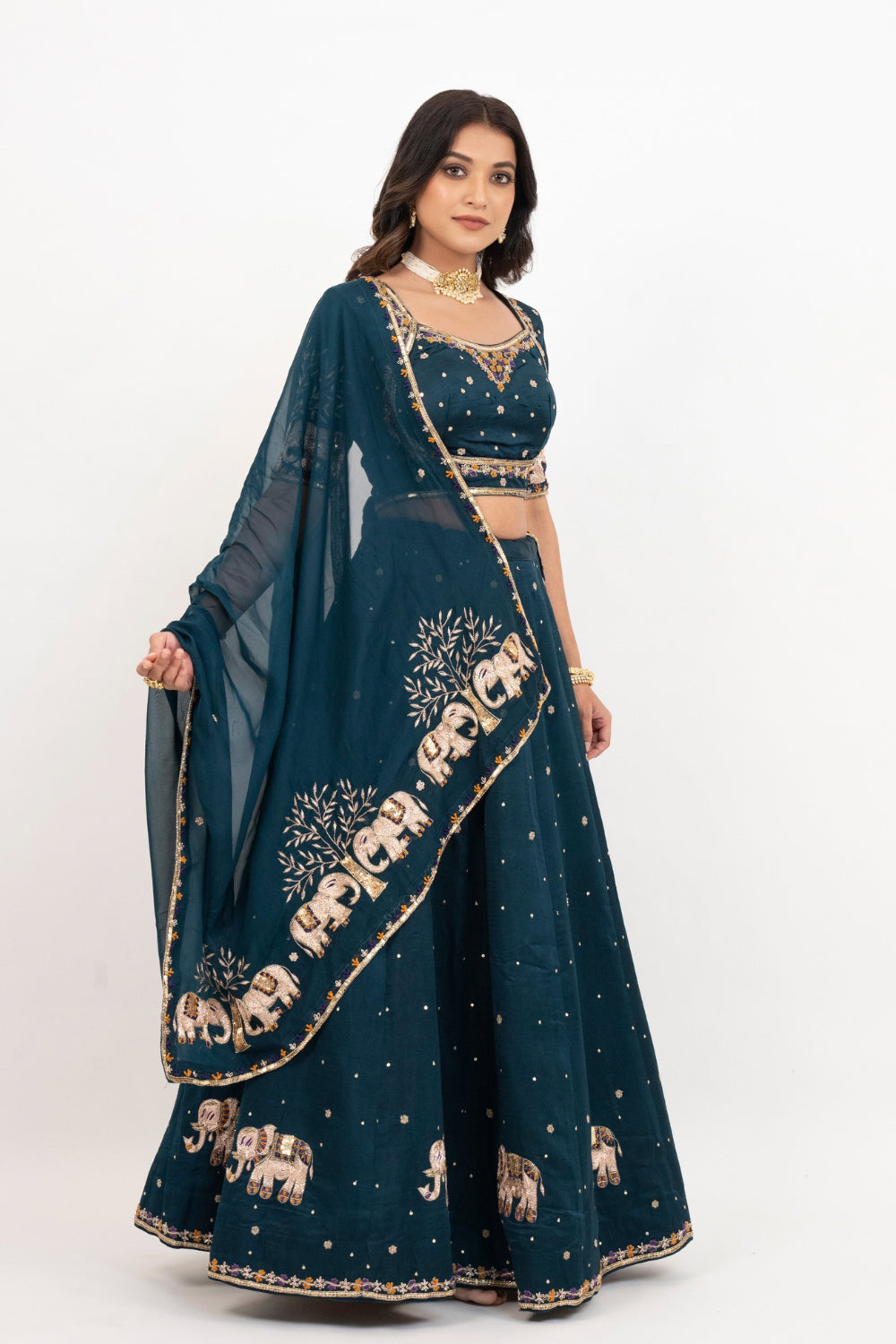 Peacock blue soft silk zardozi embroidered lehenga choli with hand cut dana work