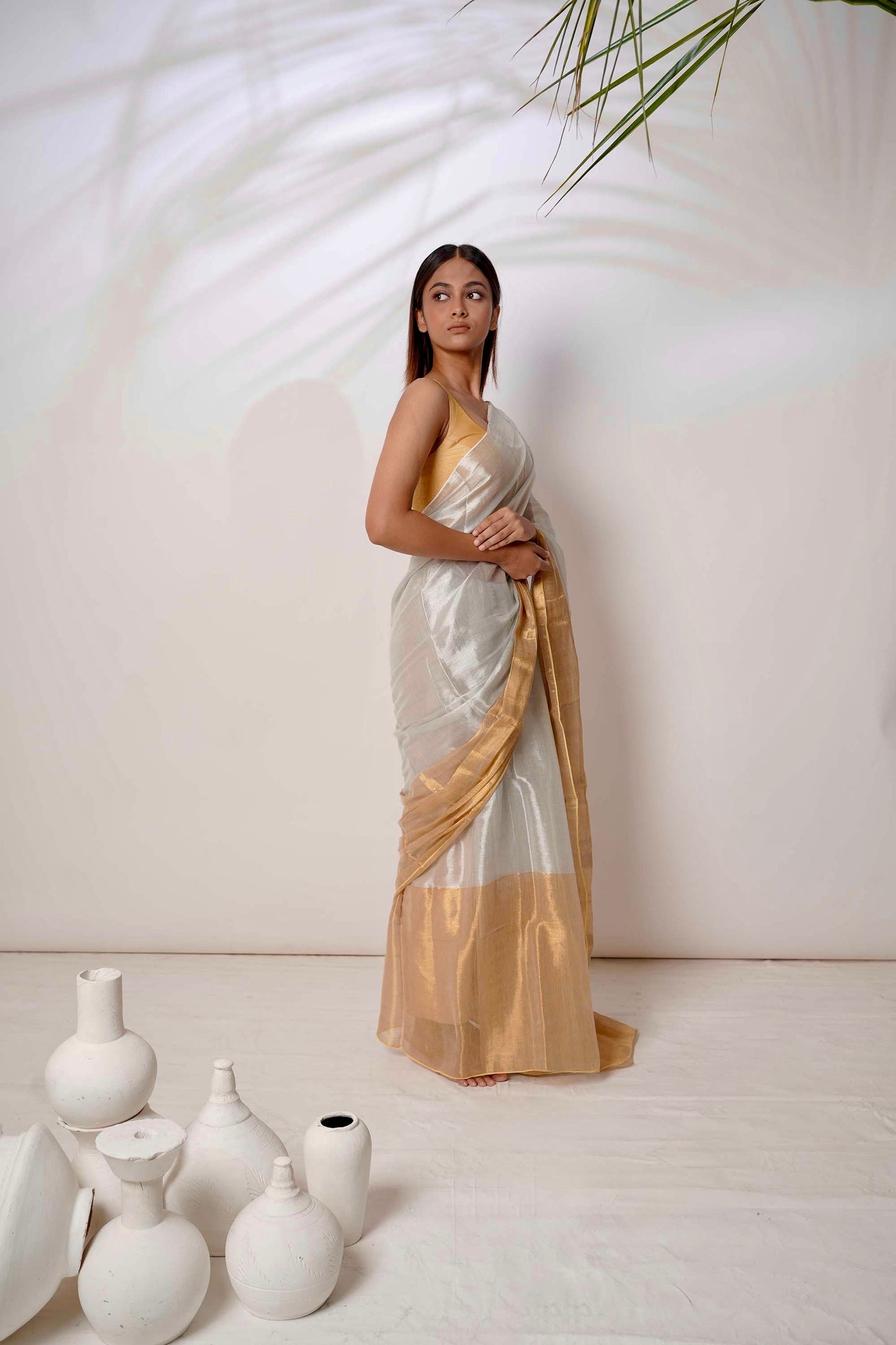 Aarna | Metallic white and gold tissue saree