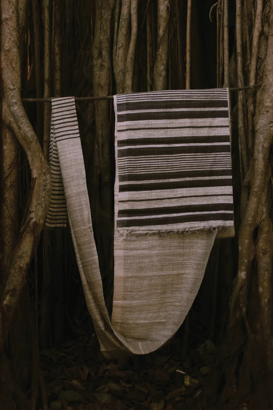 Handloom beige Kosa silk saree with Black stripes woven on it with contrasting Black pallu
