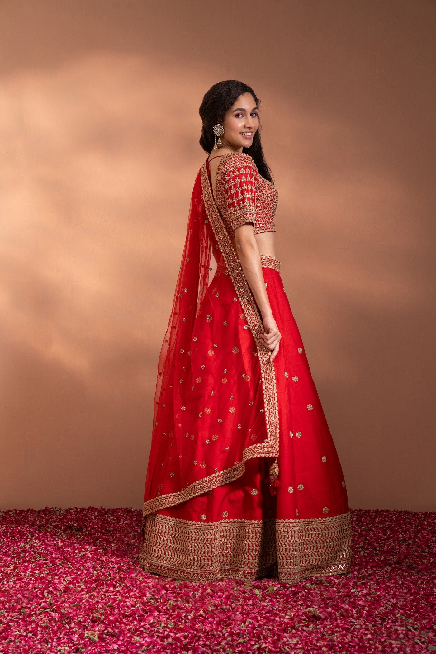 Bright Red Lehenga set in Silk with Heavy Gota & Embriodery Work.