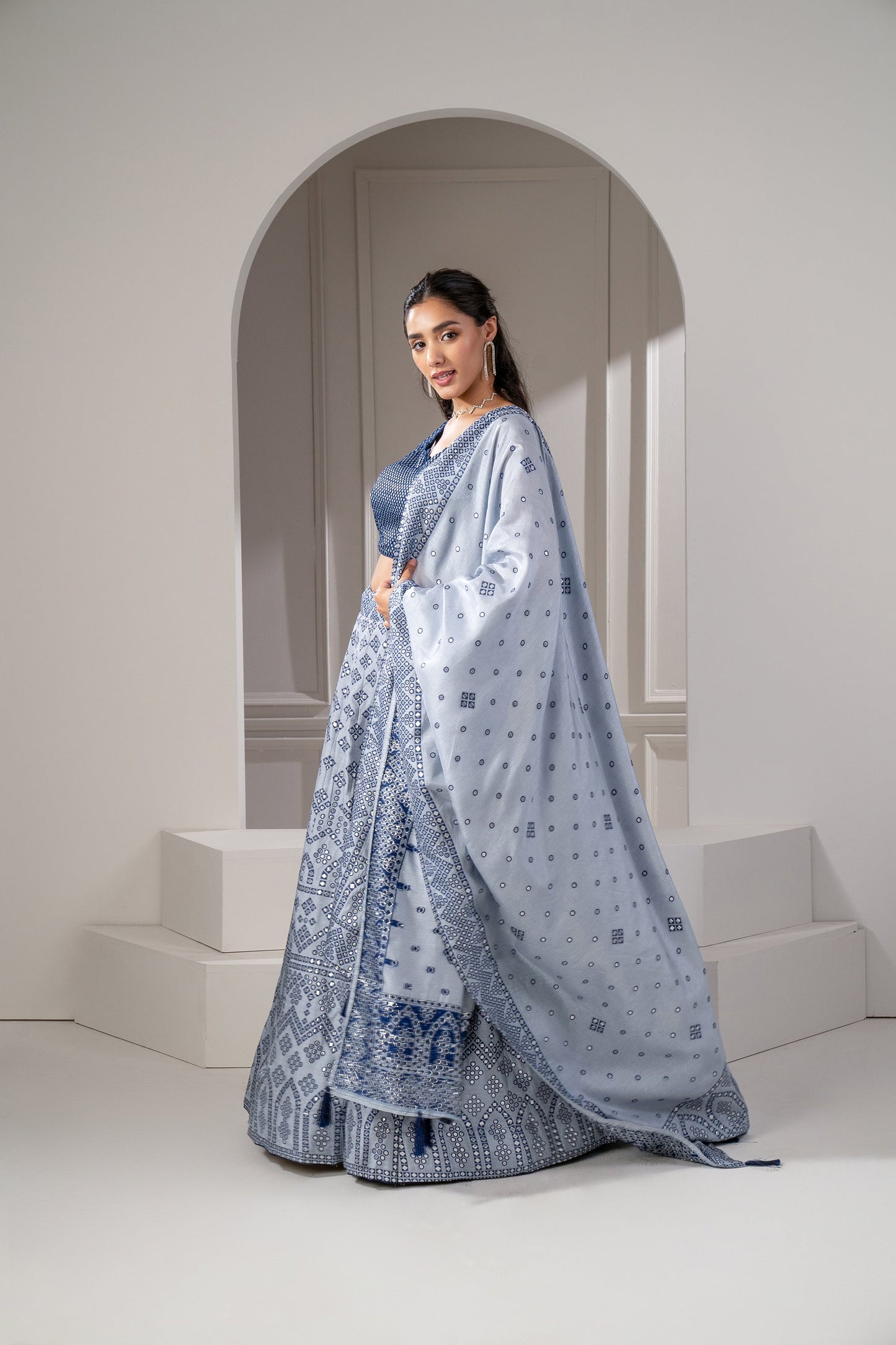Silver Blue Soft Silk Lehenga Set with Mirror Embellishements.