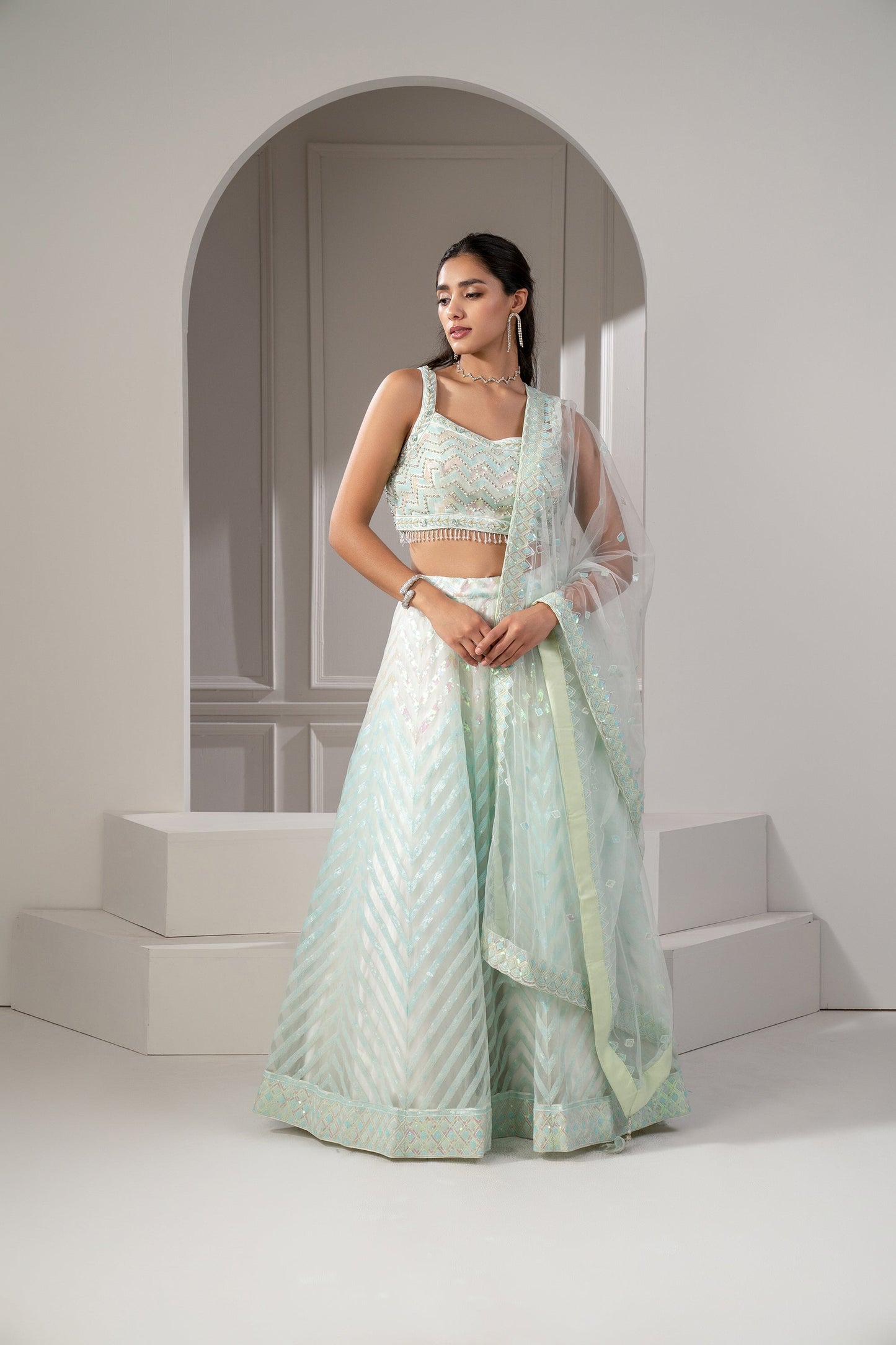 Pista Green Organaza Net Lehenga Set with sequins and stone embellishments.