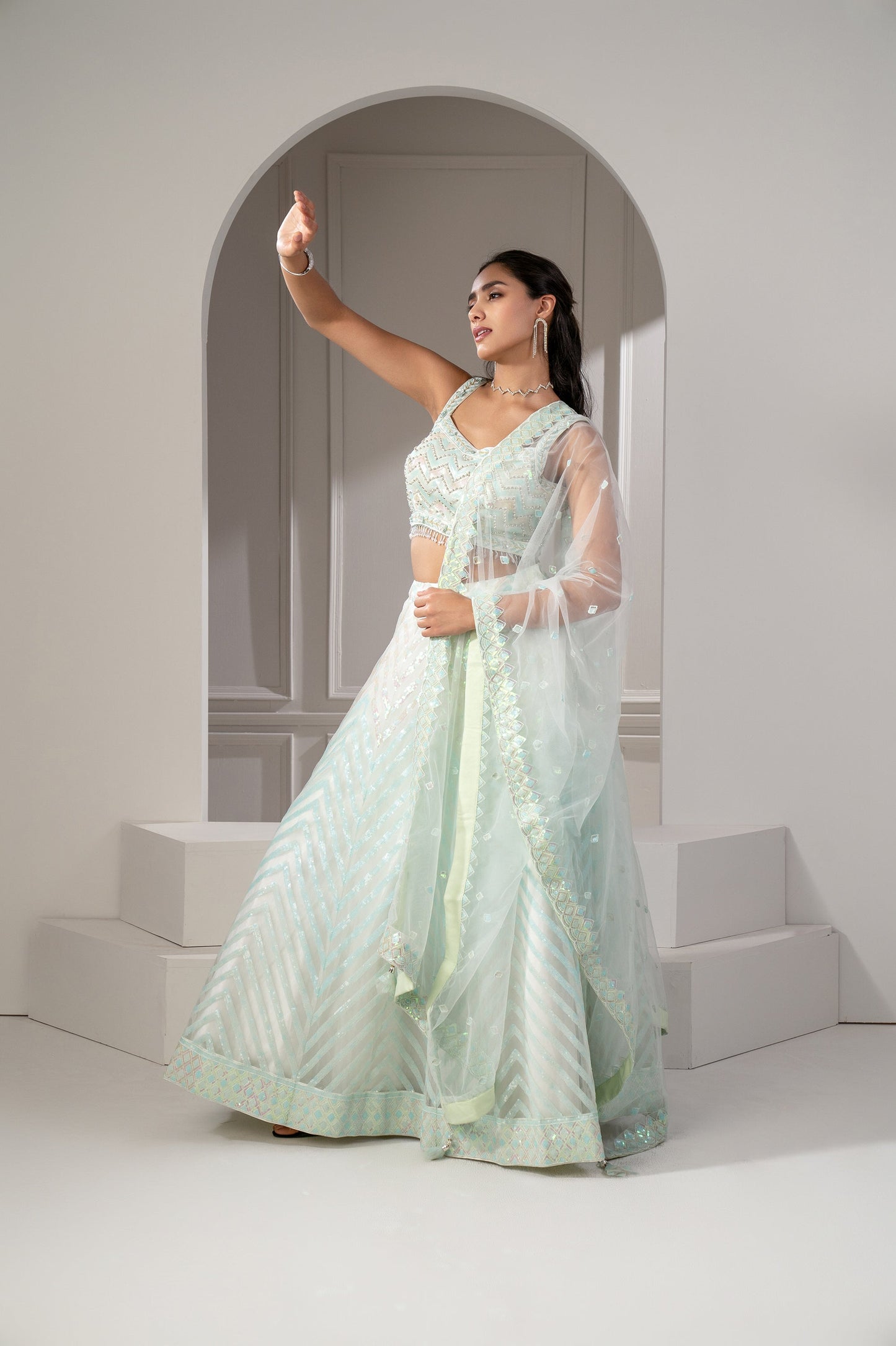 Pista Green Organaza Net Lehenga Set with sequins and stone embellishments.