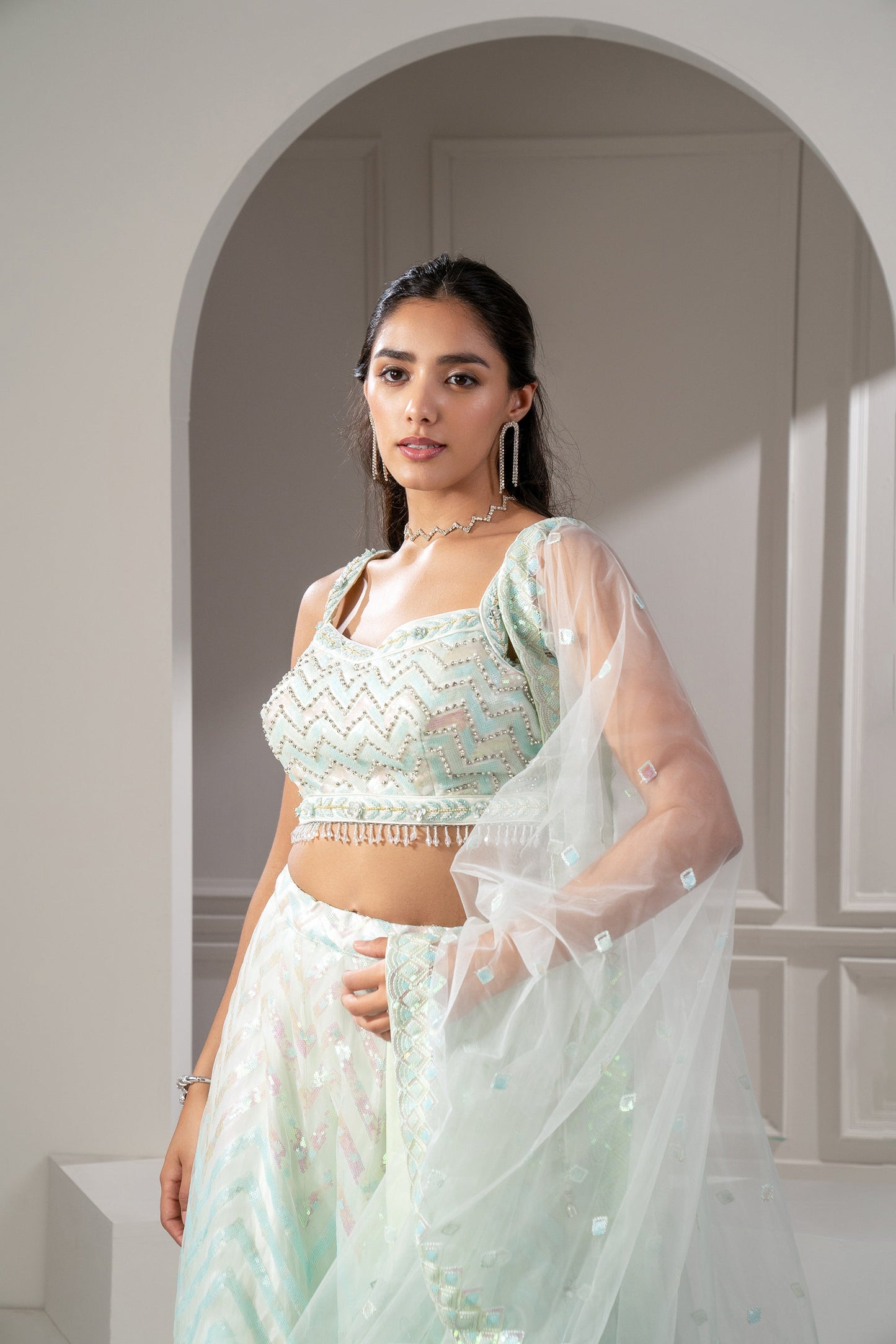 Pista Green Organaza Net Lehenga Set with sequins and stone embellishments.