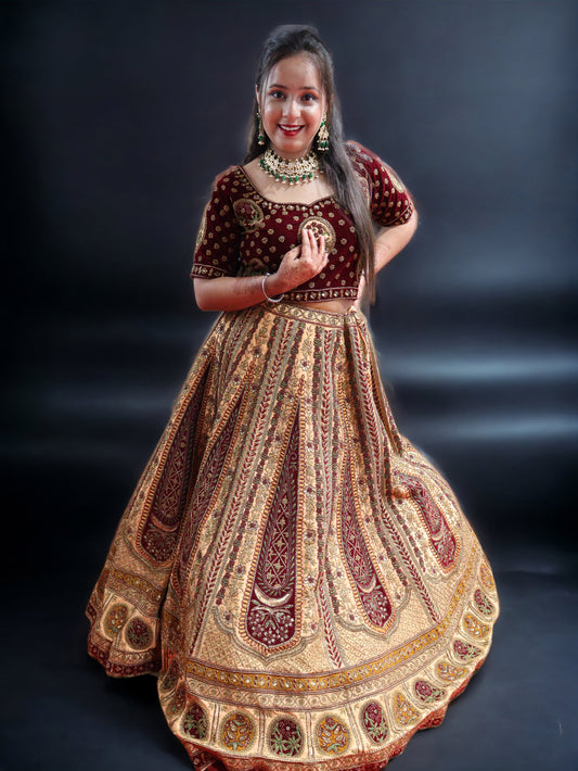 Golden and Maroon Rajwada Raw Silk  Hand Embroidered Antique Work Bridal Lehenga