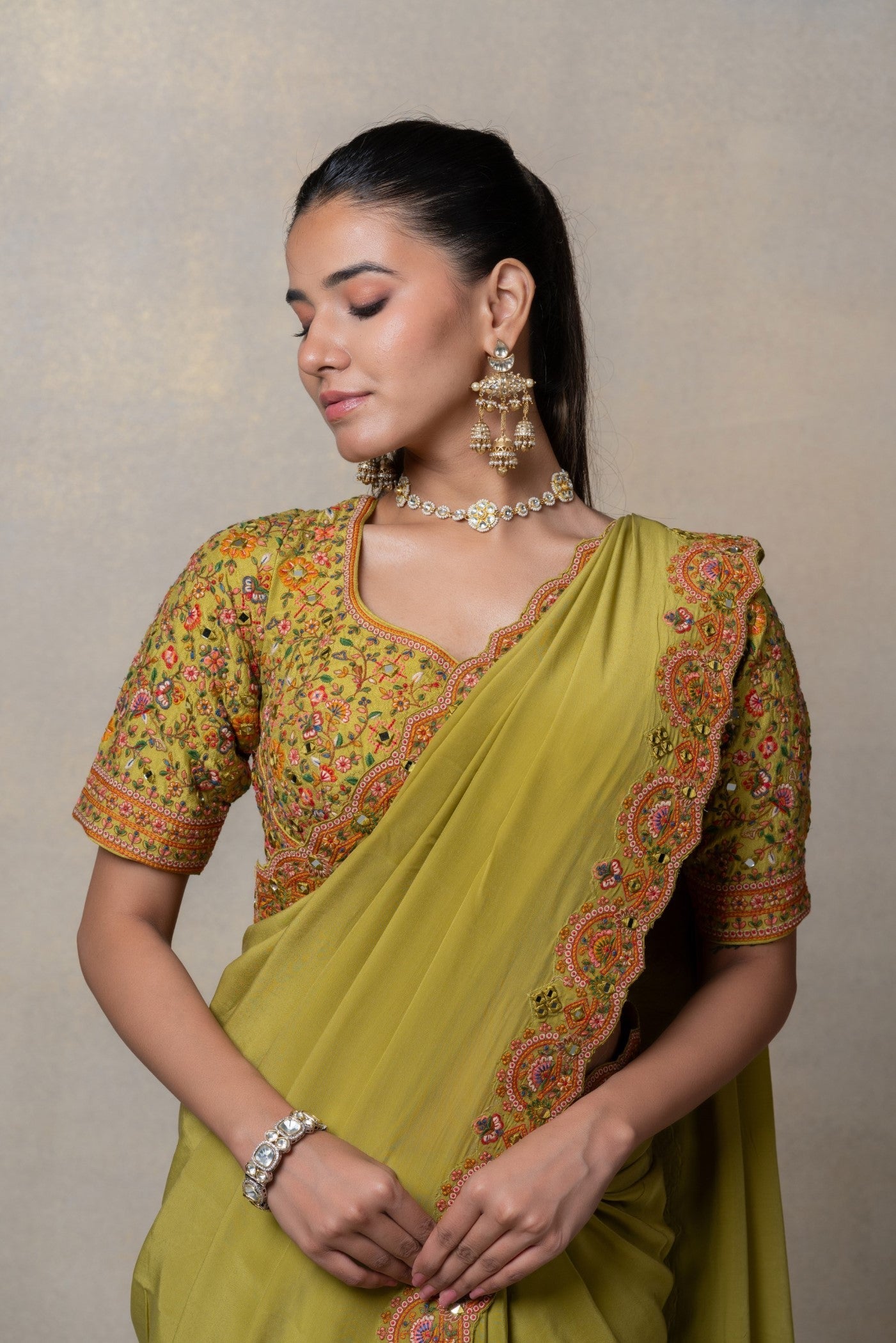 Mehendi green crepe silk resham and mirror embellished saree