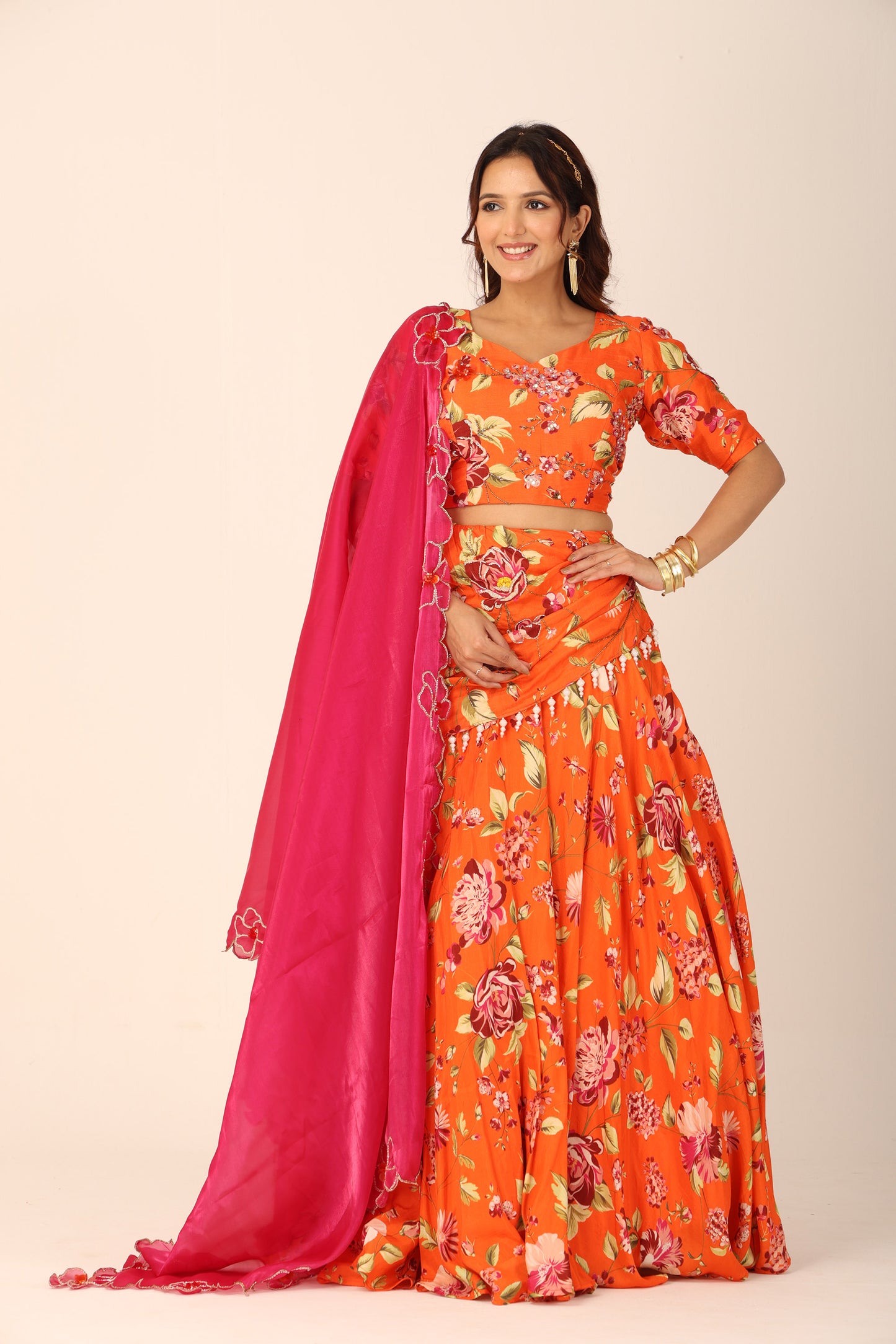 Floral orangeade hand-embroidered lehenga set with fuchsia organza dupatta