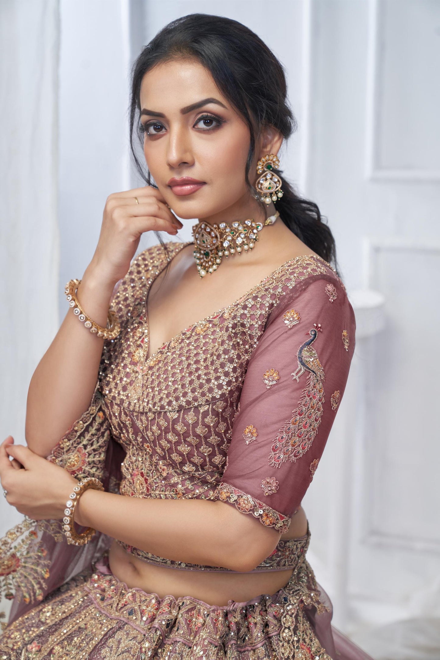 Onion Pink Soft Net With Paisley And Peacock Motifs Bridal Lehenga