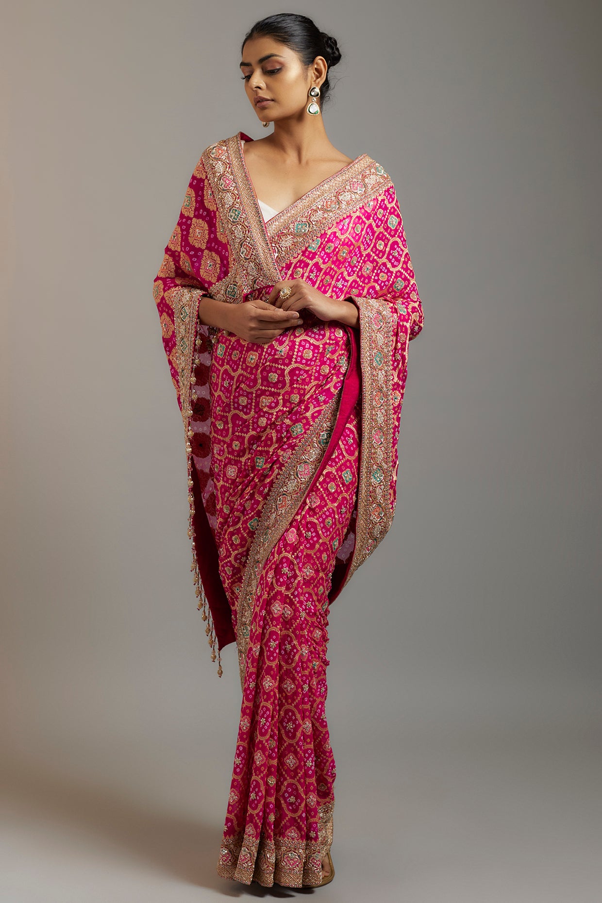 rani pink silk sequins embellished bandhej patola saree set