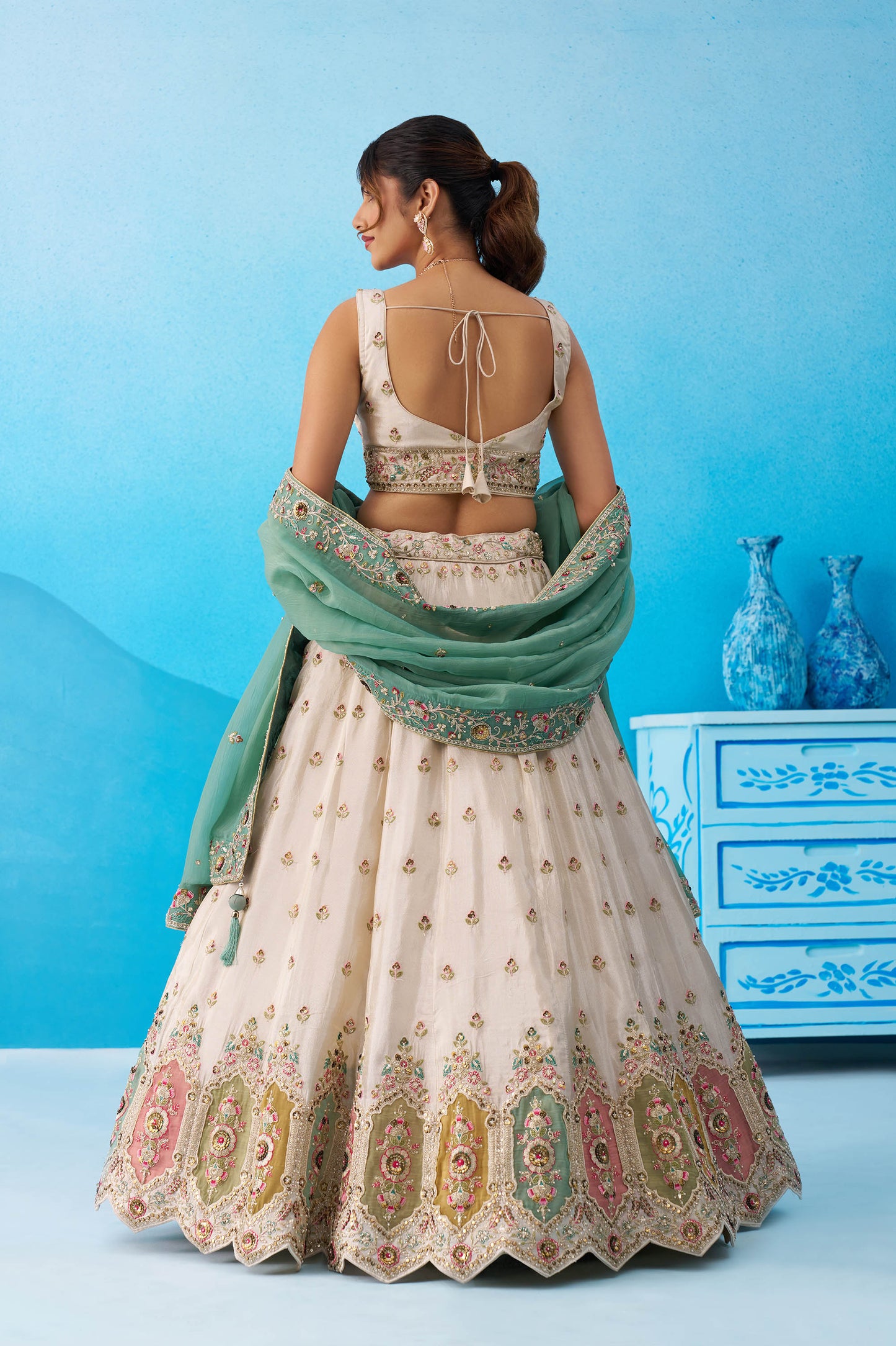 Cream & Sea Green Tissue Sequins Embroidered Lehenga Choli