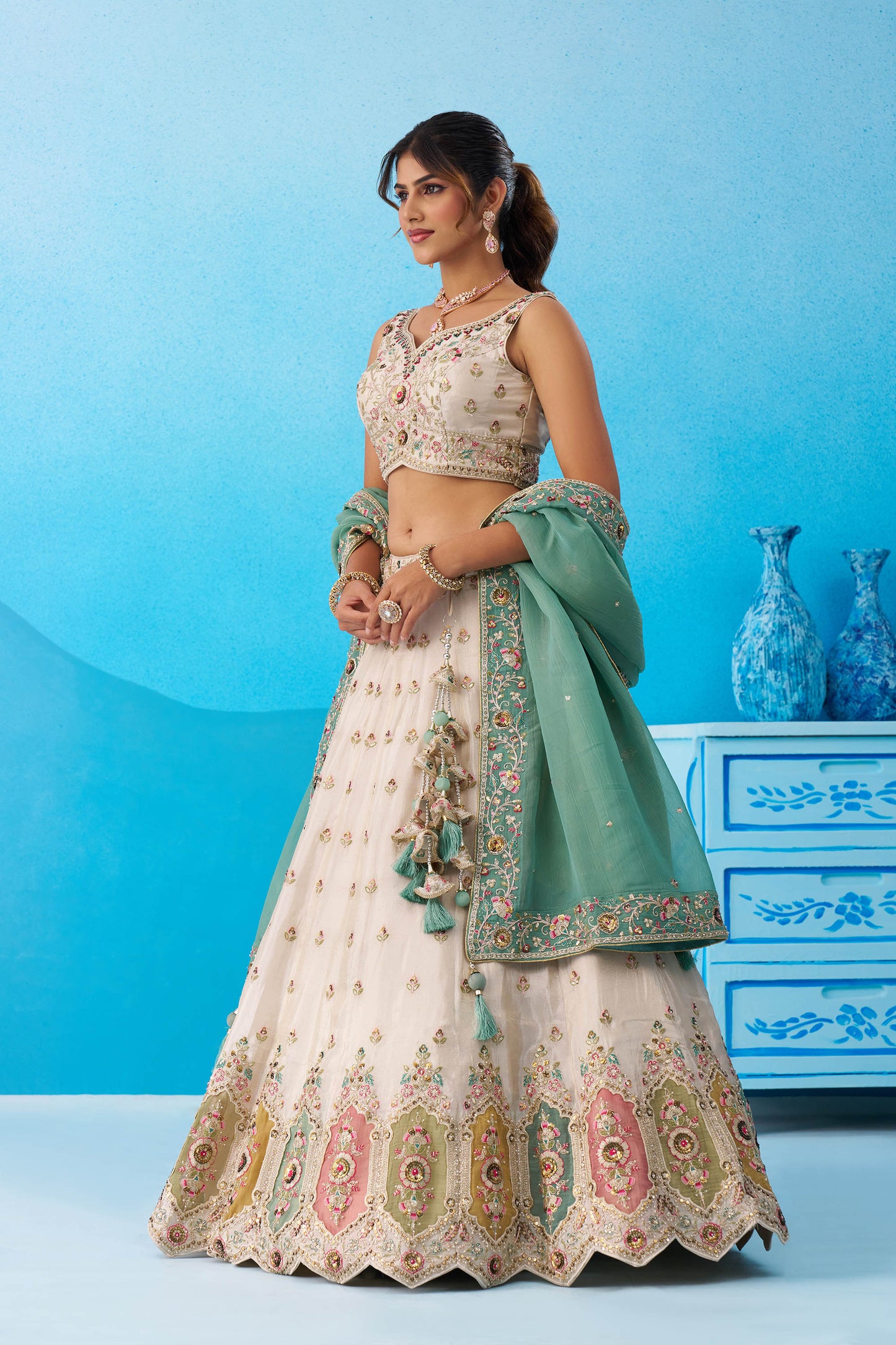 Cream & Sea Green Tissue Sequins Embroidered Lehenga Choli