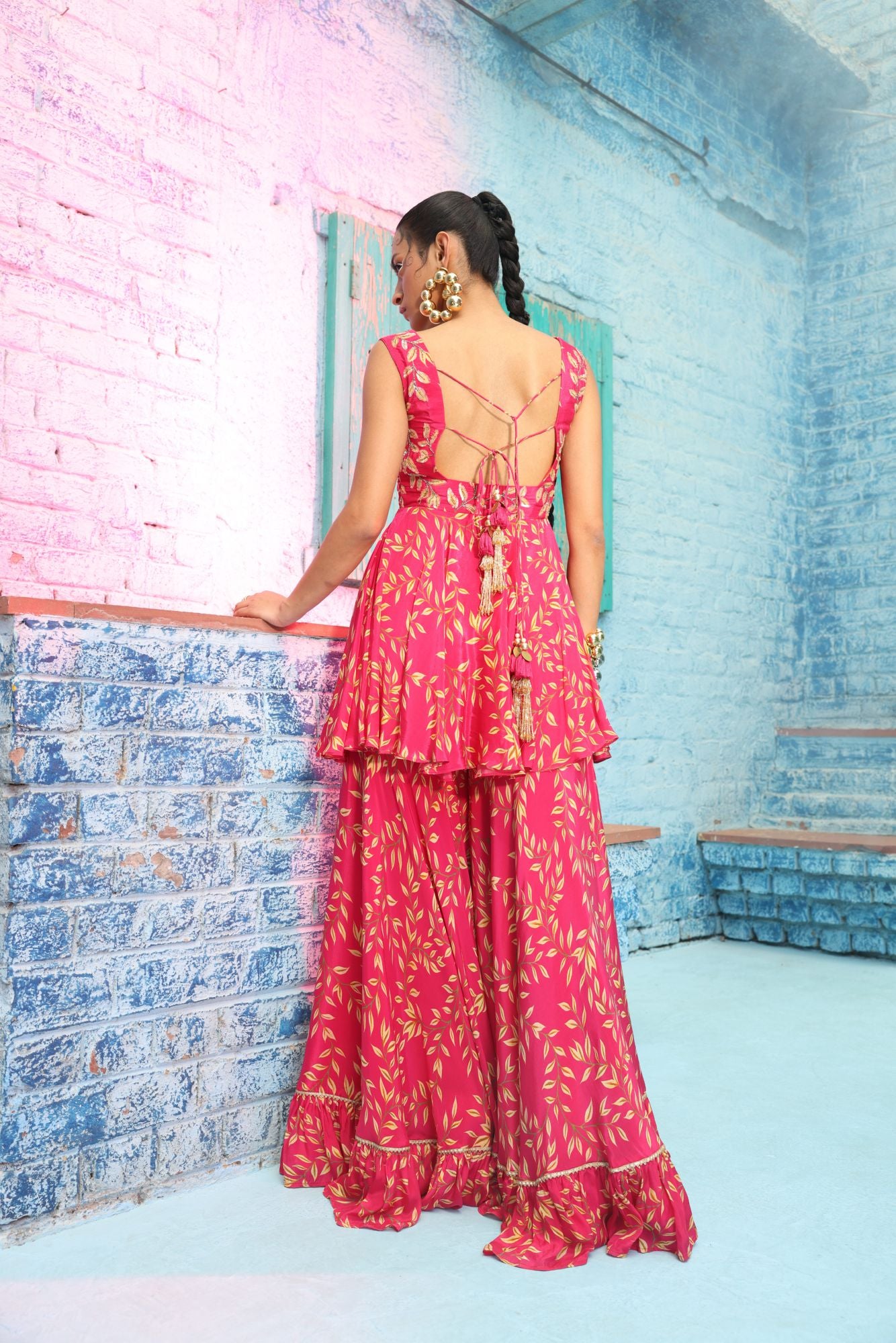 Rasberry pink digital printed flared Crepe gharara and hand embroidered tunic paired up with braided belt