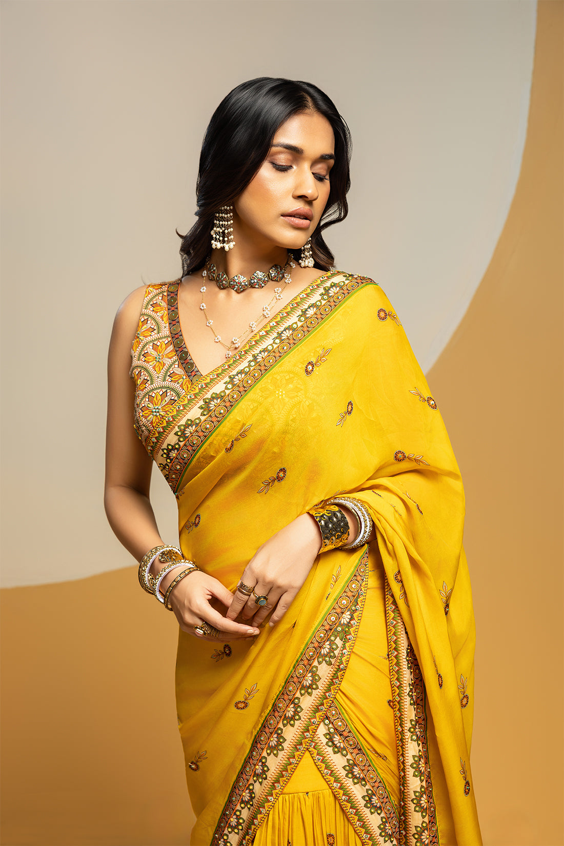 Taarani embellished pre-stitched saree set