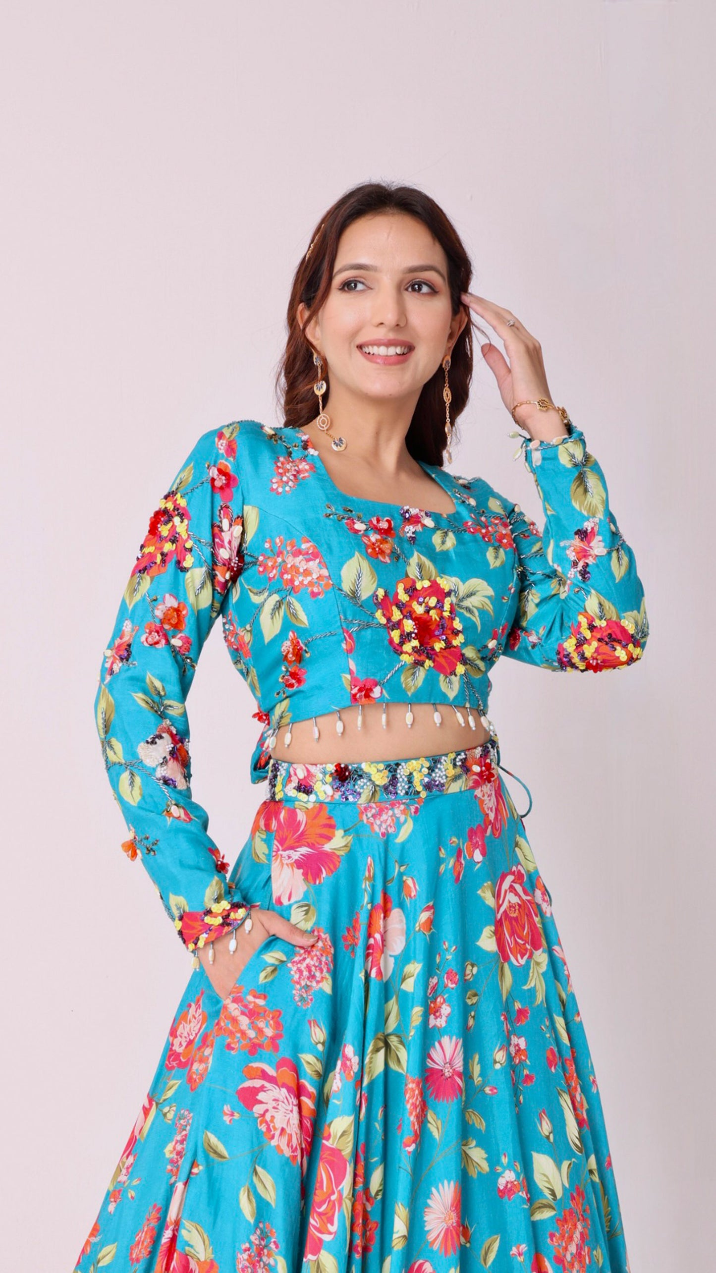 Vibrant floral embroidered turquoise blue skirt & choli set with back tie-up