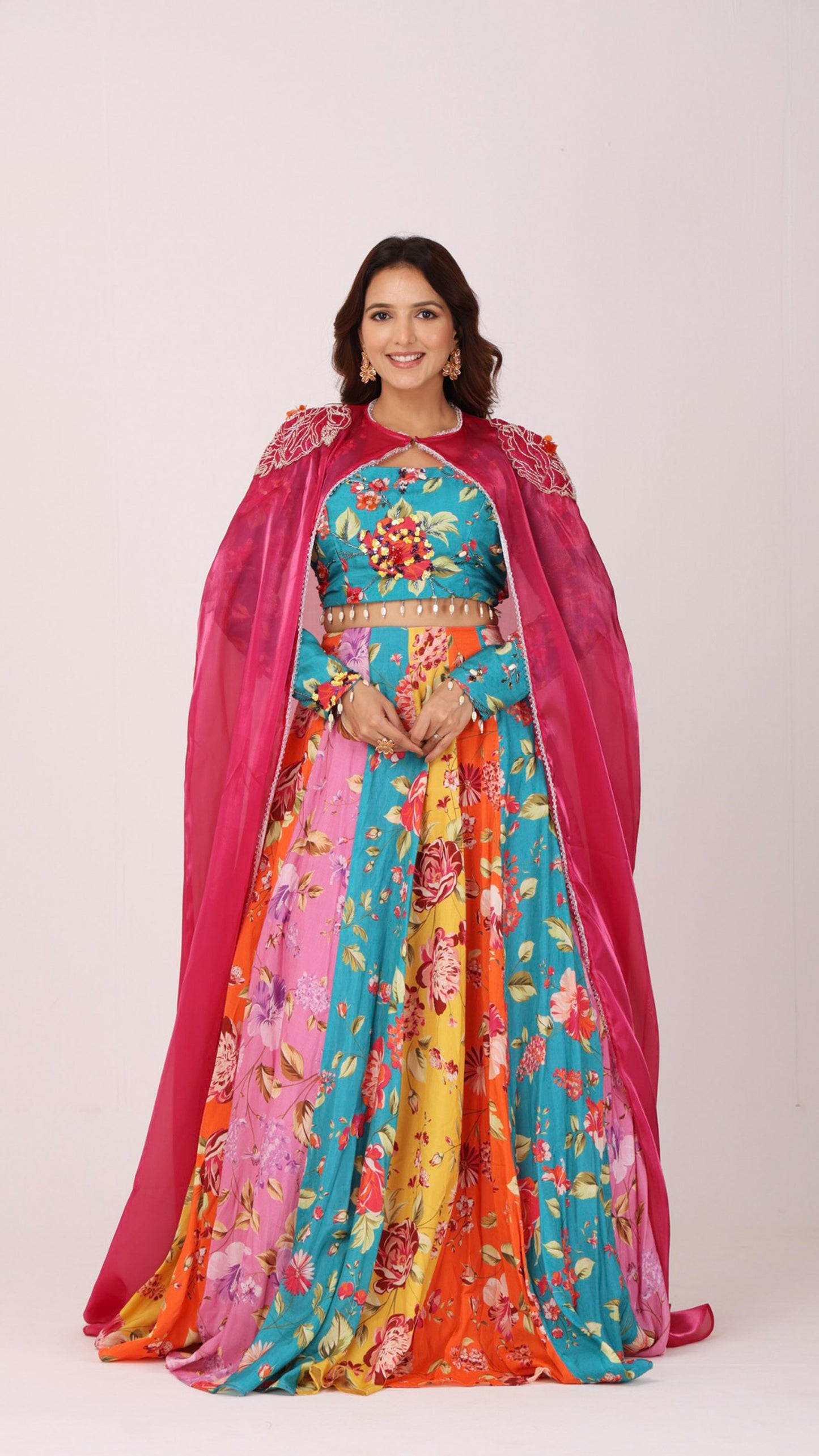 Orangeade Bold multi-colour floral kali lehenga paired with embroidered blouse and cape