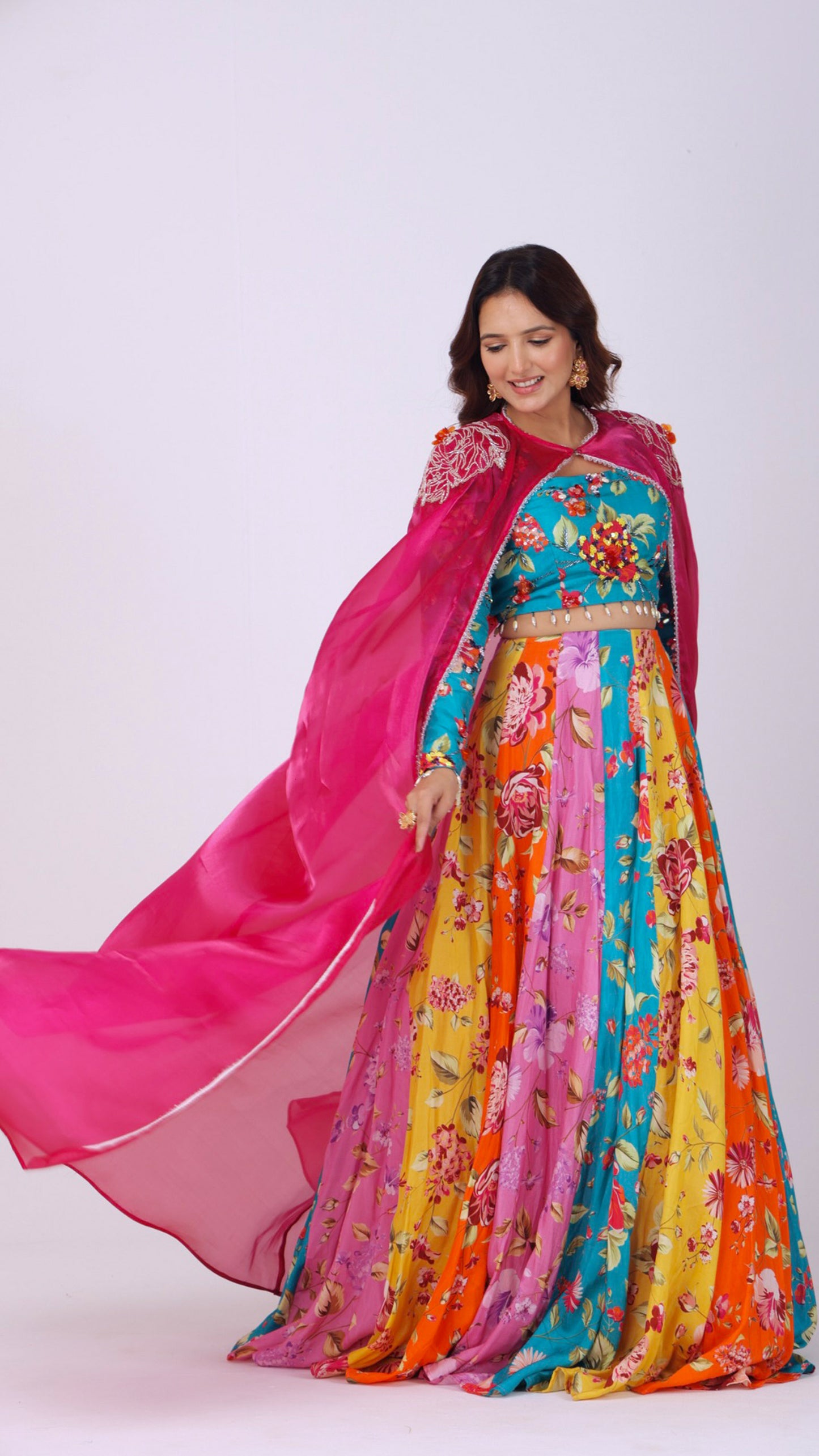 Orangeade Bold multi-colour floral kali lehenga paired with embroidered blouse and cape