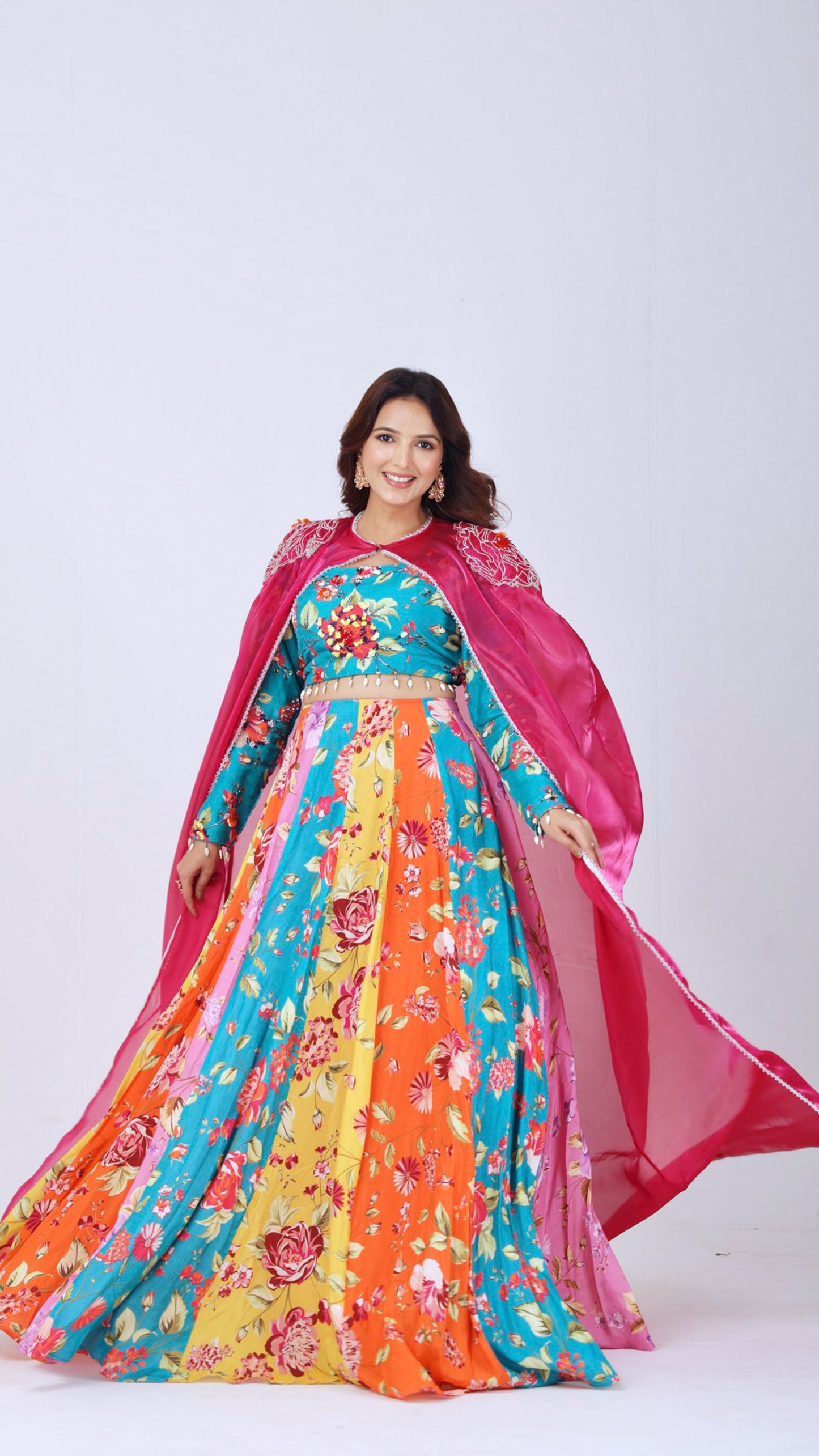 Orangeade Bold multi-colour floral kali lehenga paired with embroidered blouse and cape