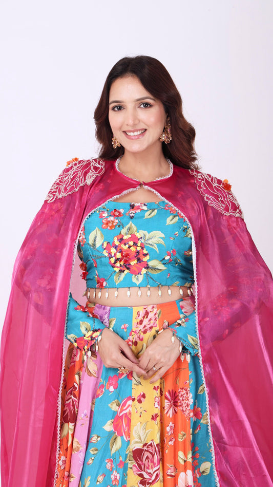 Orangeade Bold multi-colour floral kali lehenga paired with embroidered blouse and cape