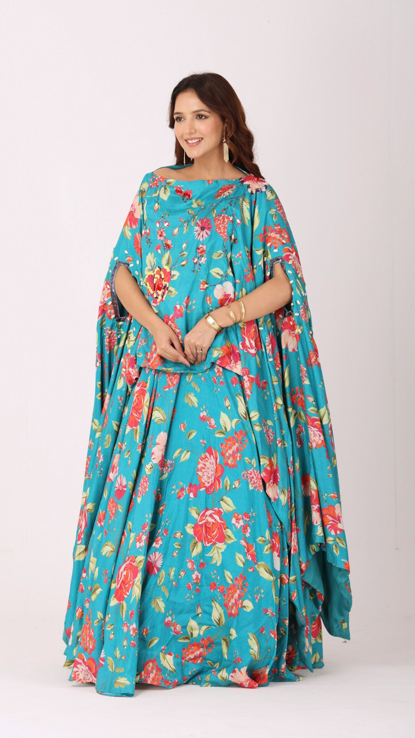 Turquoise floral kaftan kurti blouse paired with a matching flared lehenga