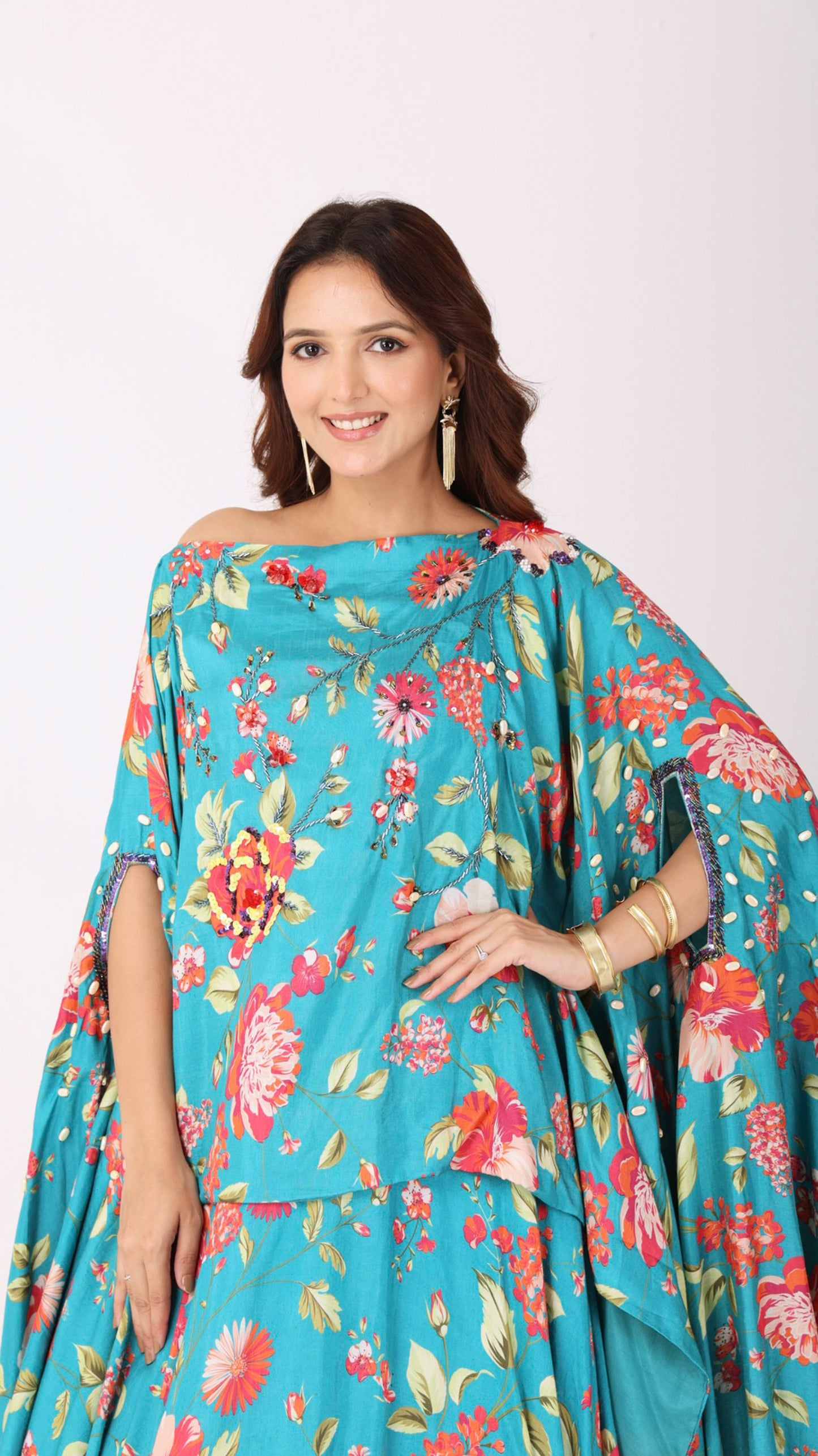 Turquoise floral kaftan kurti blouse paired with a matching flared lehenga