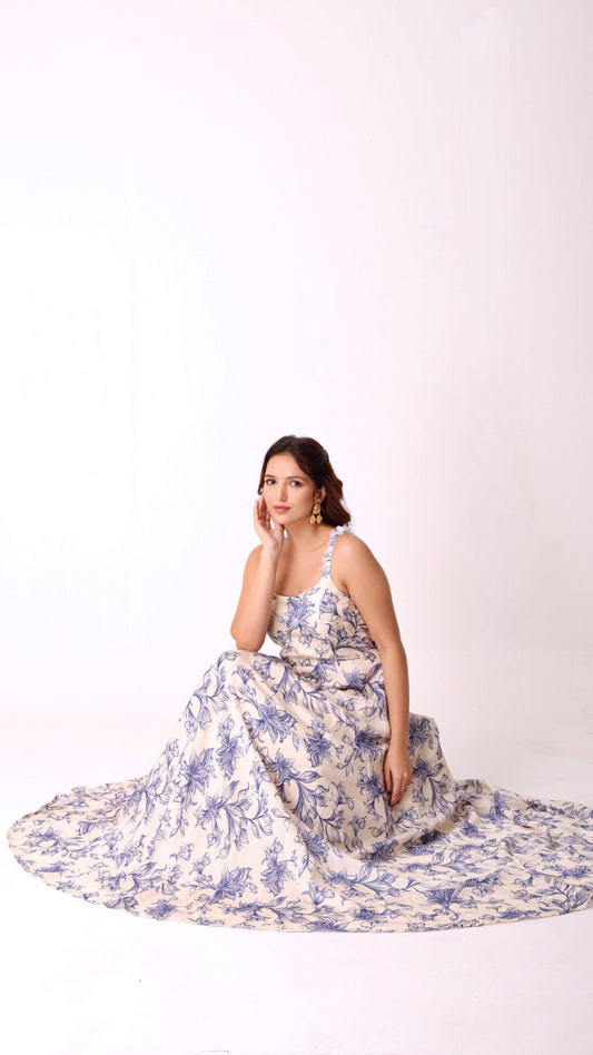 Graceful hand-embroidered ivory floral flare dress with soft blue blooms