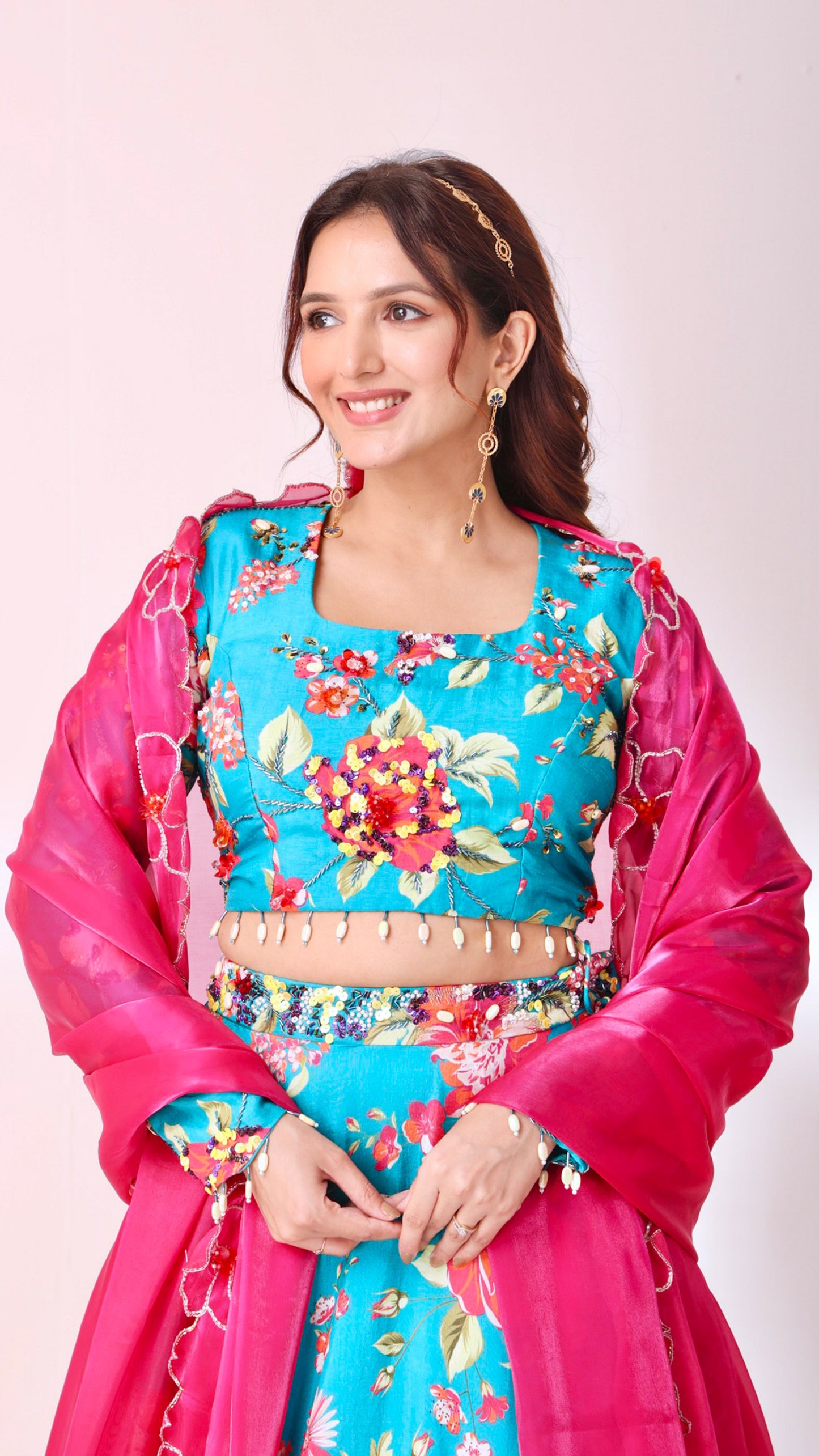 Floral hand- embroidered turquoise lehenga choli set with a contrasting dupatta