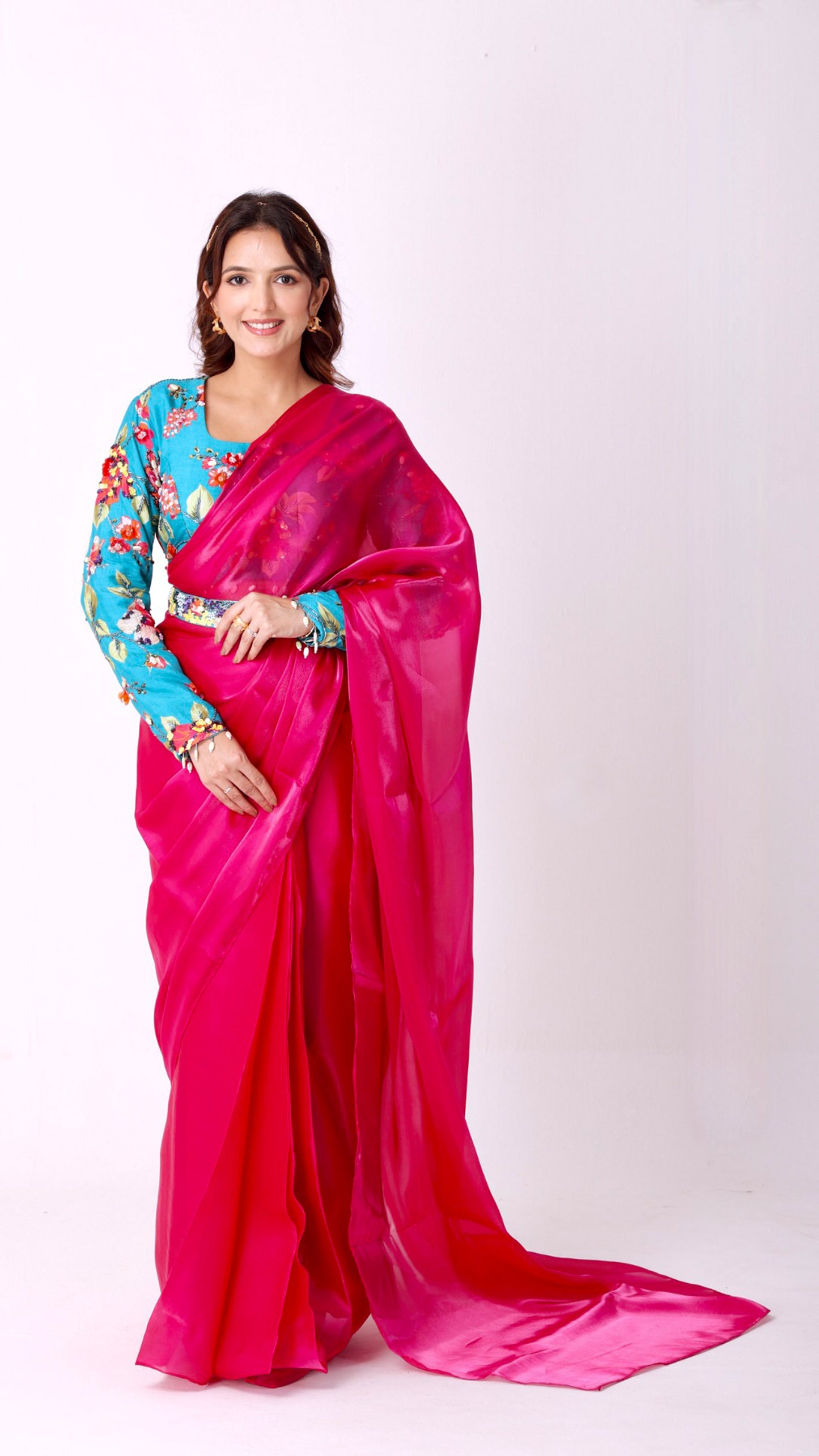 Fuchsia organza saree with floral hand-embroidered statement blouse and belt