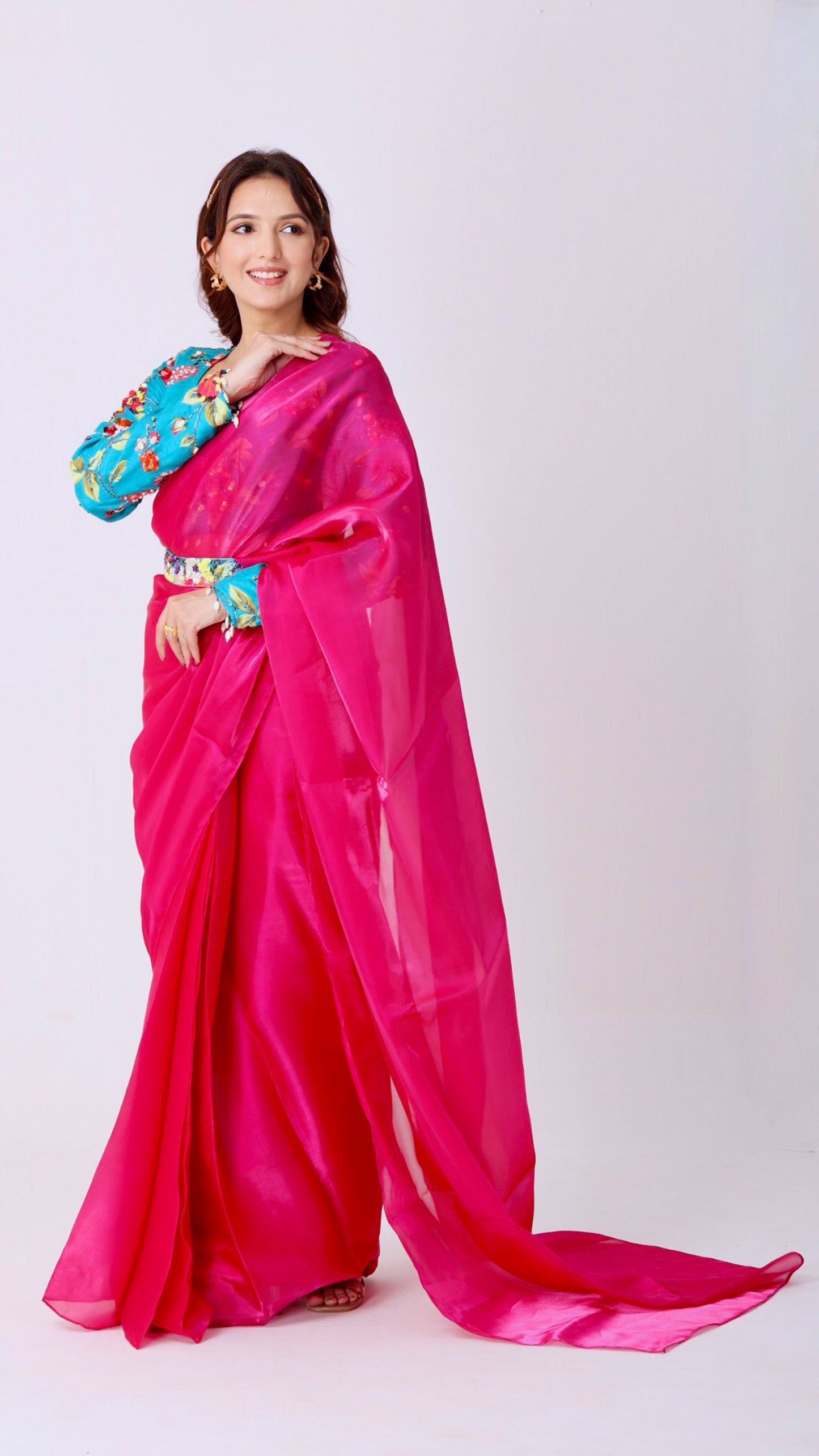 Fuchsia organza saree with floral hand-embroidered statement blouse and belt