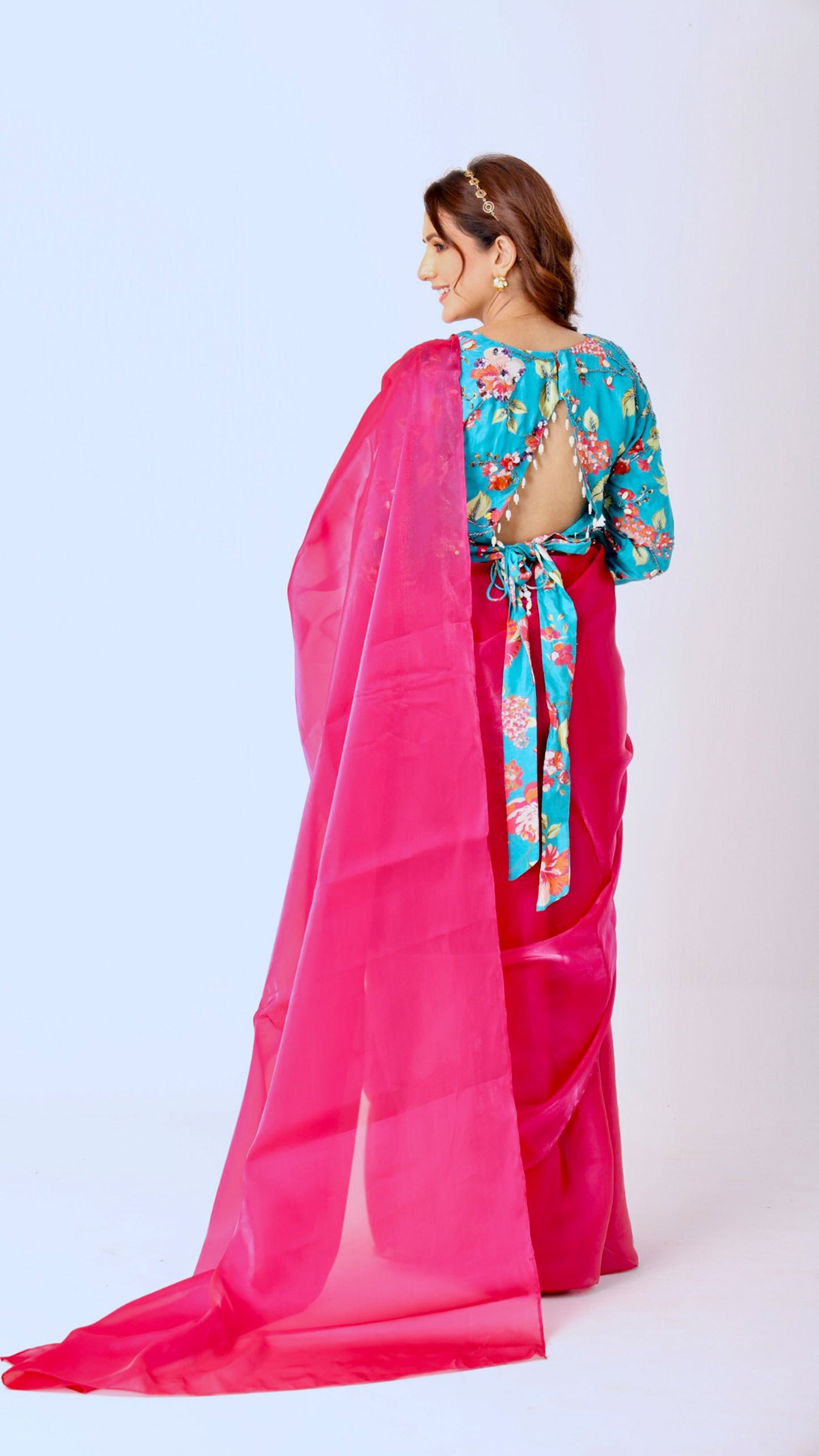 Fuchsia organza saree with floral hand-embroidered statement blouse and belt