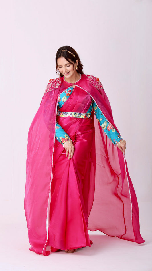 Fuchsia saree with embroidered cape & floral belt paired with printed blouse