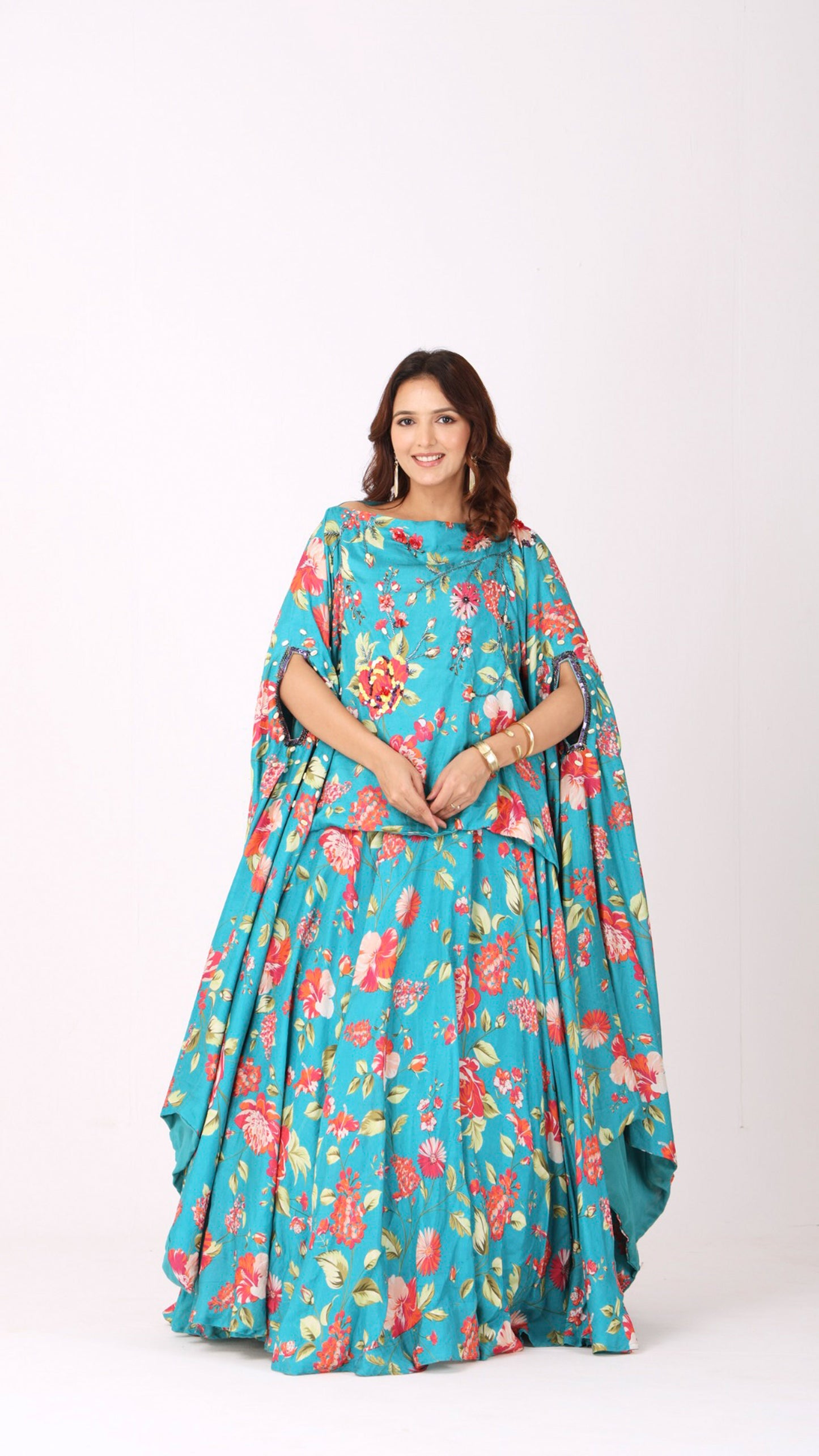 Turquoise floral kaftan kurti blouse paired with a matching flared lehenga