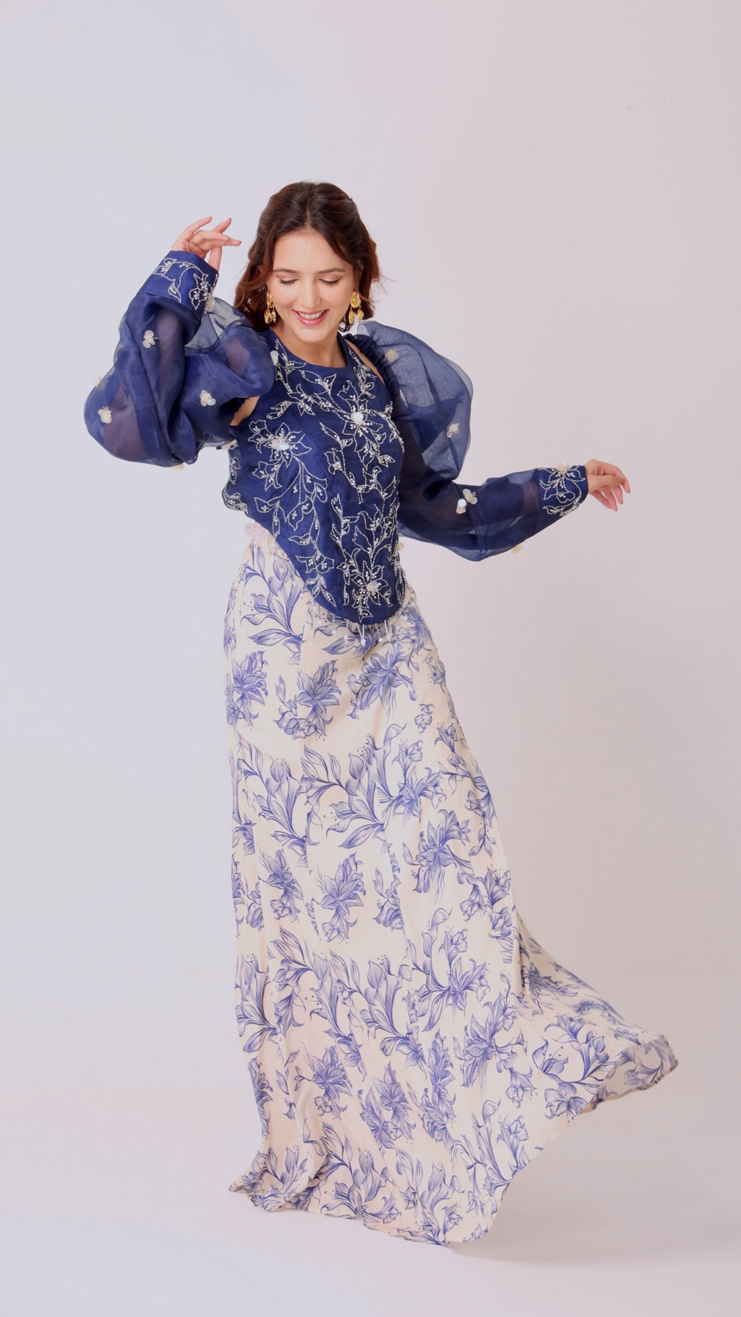 Embroidered navy halter top with dramatic puff sleeve & floral flair ivory skirt