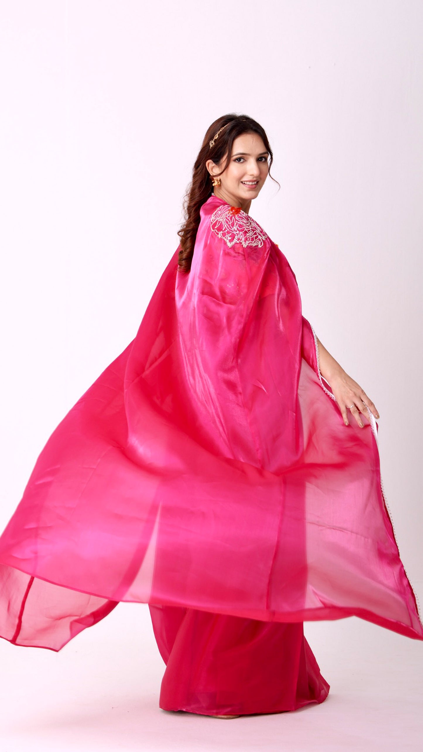 Fuchsia statement saree and embroidered cape with floral embellished blouse