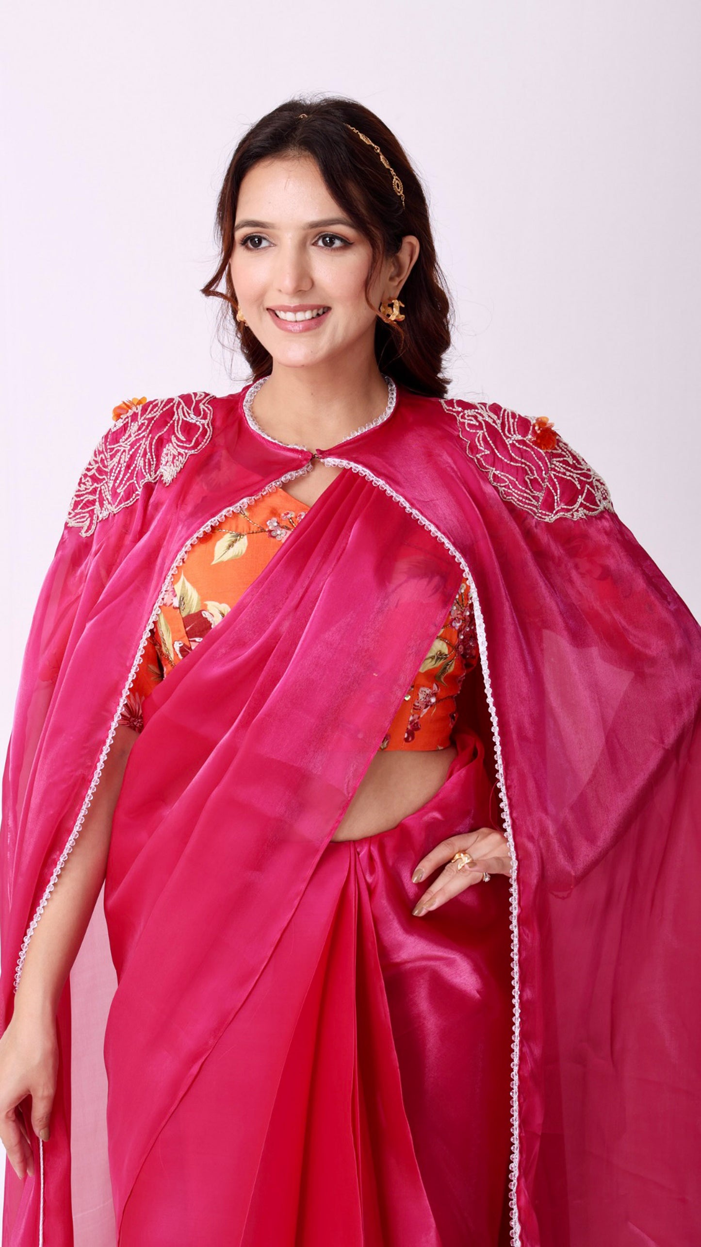 Fuchsia statement saree and embroidered cape with floral embellished blouse